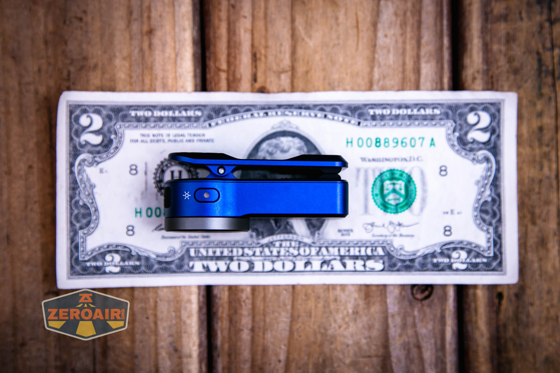 Wurkkos HD03 clip flashlight on a two dollar bill