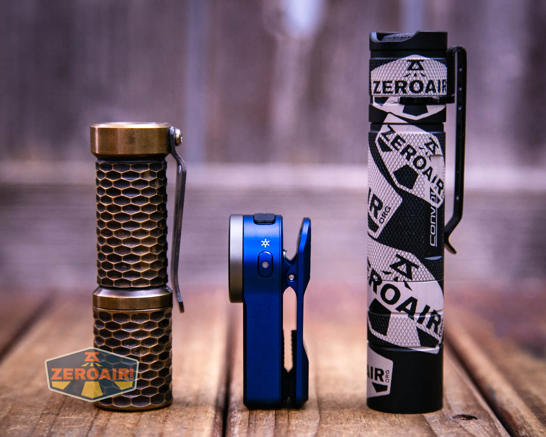 Wurkkos HD03 clip flashlight with two standard sized flashlights