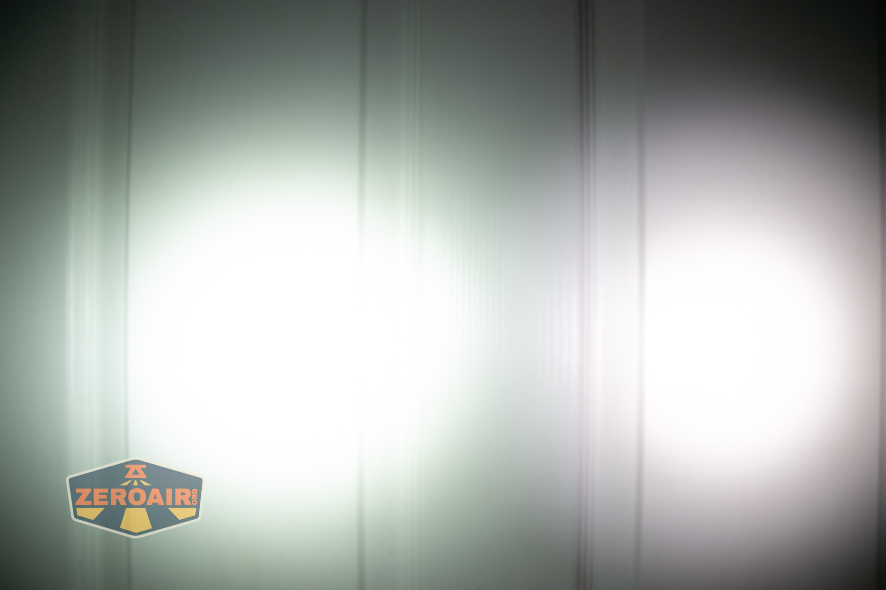 Wurkkos HD03 clip flashlight beamshots on door (at 1') compared to nichia 219b 4500K