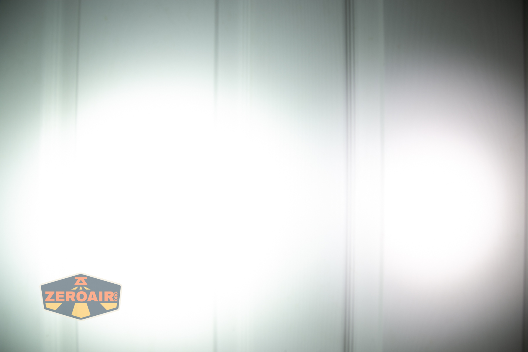 Wurkkos HD03 clip flashlight beamshots on door (at 1') compared to nichia 219b 4500K