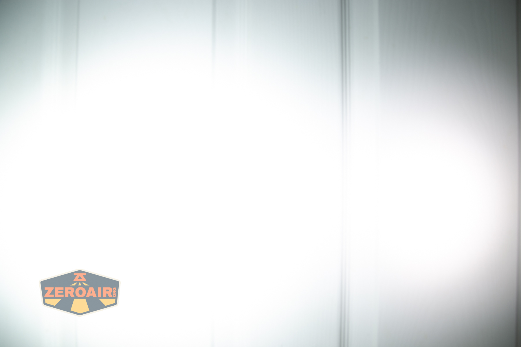 Wurkkos HD03 clip flashlight beamshots on door (at 1') compared to nichia 219b 4500K