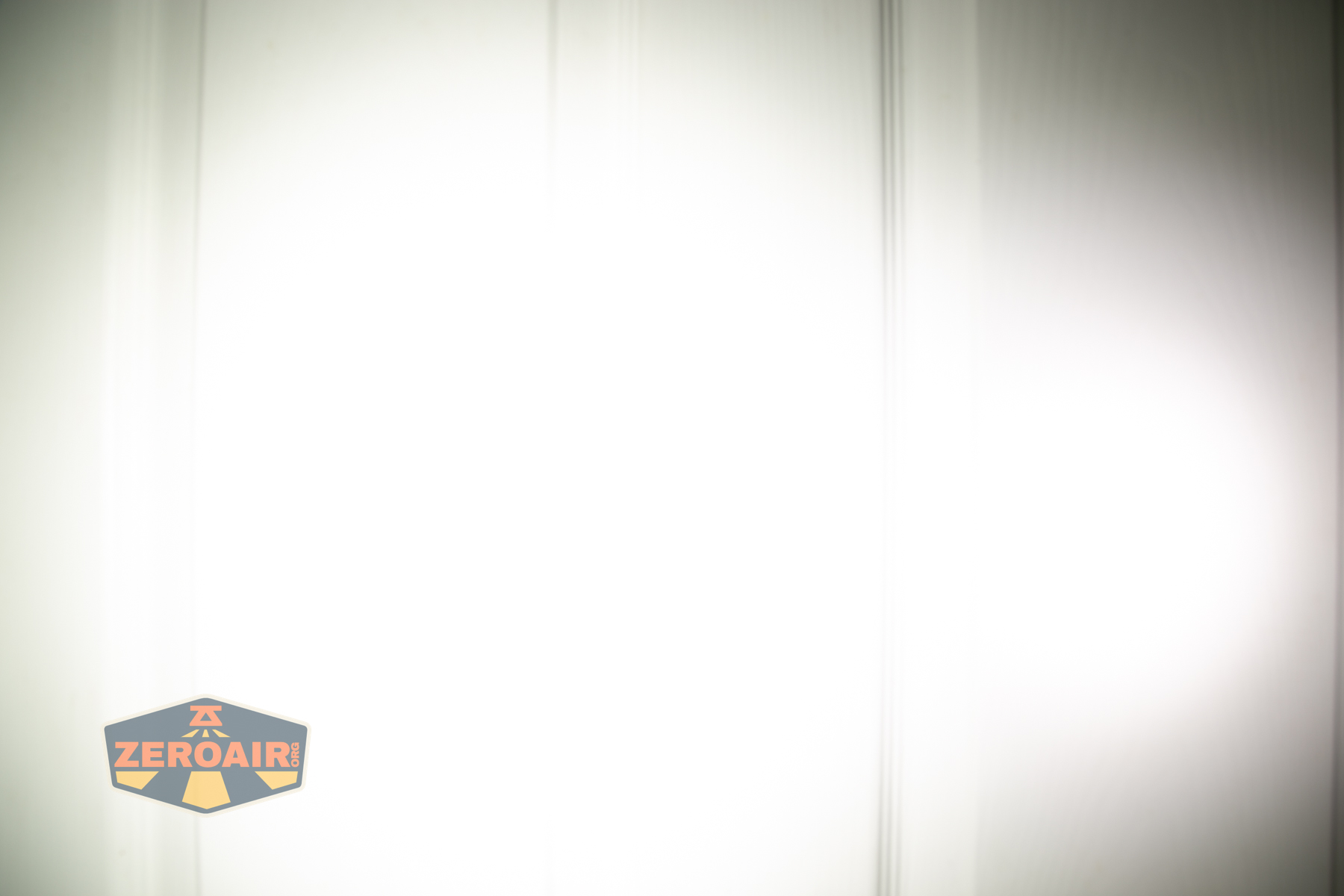 Wurkkos HD03 clip flashlight beamshots on door (at 1') compared to nichia 219b 4500K