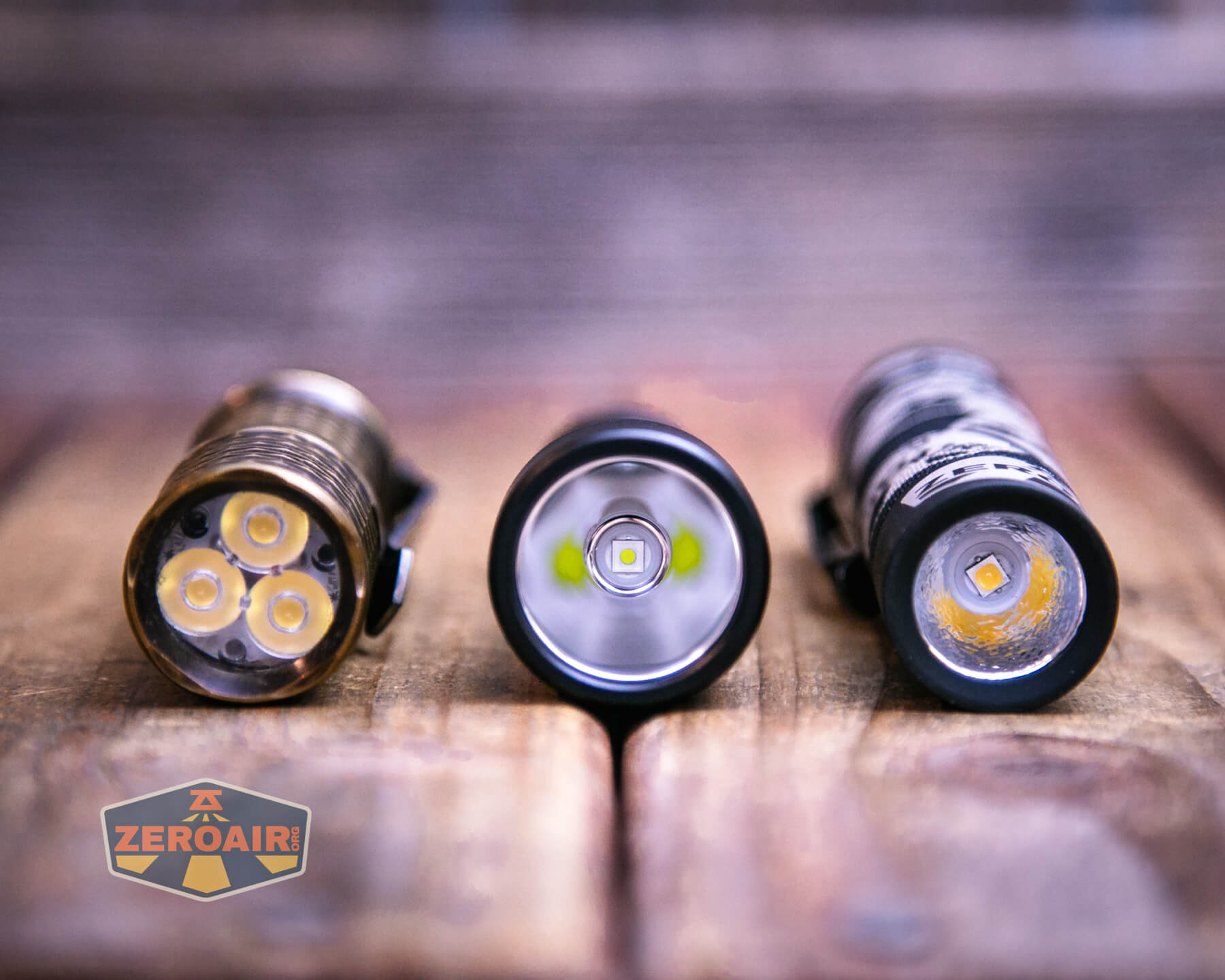 Wurkkos TS15 mini thrower flashlight with two standard sized flashlights