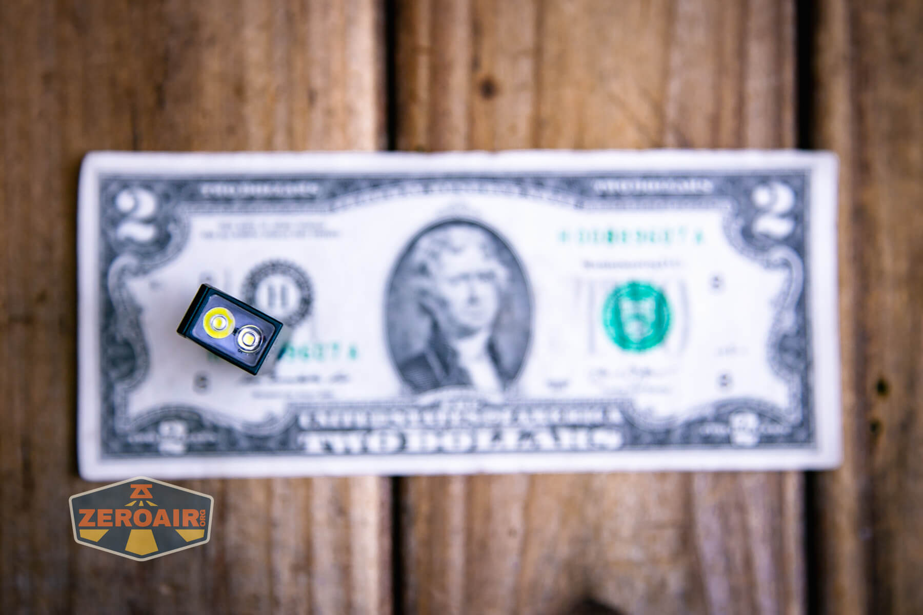 Acebeam Keylite 500 keychain flashlight on a two dollar bill