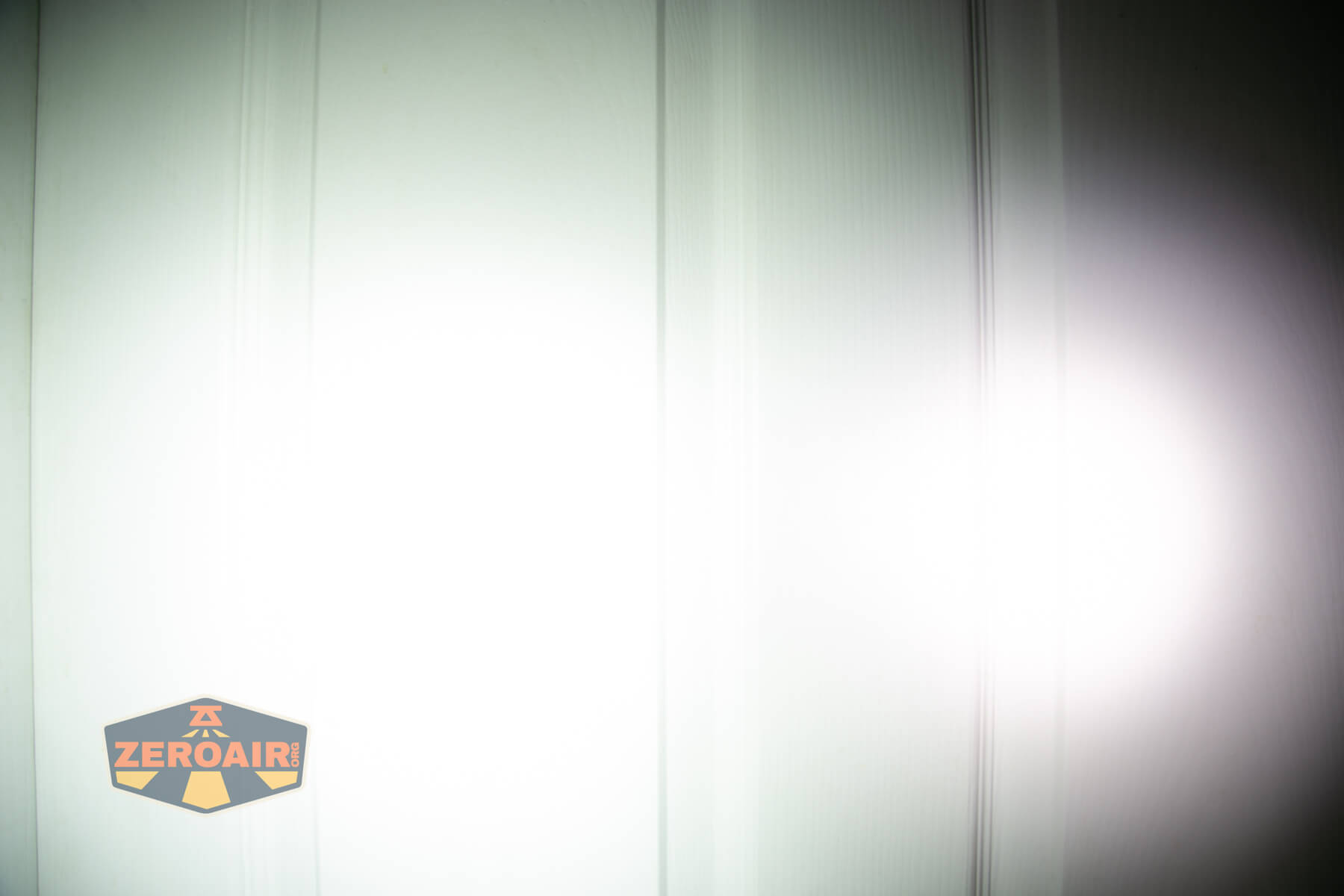 Acebeam Keylite 500 keychain flashlight beamshots on door (at 1') compared to nichia 219b 4500K