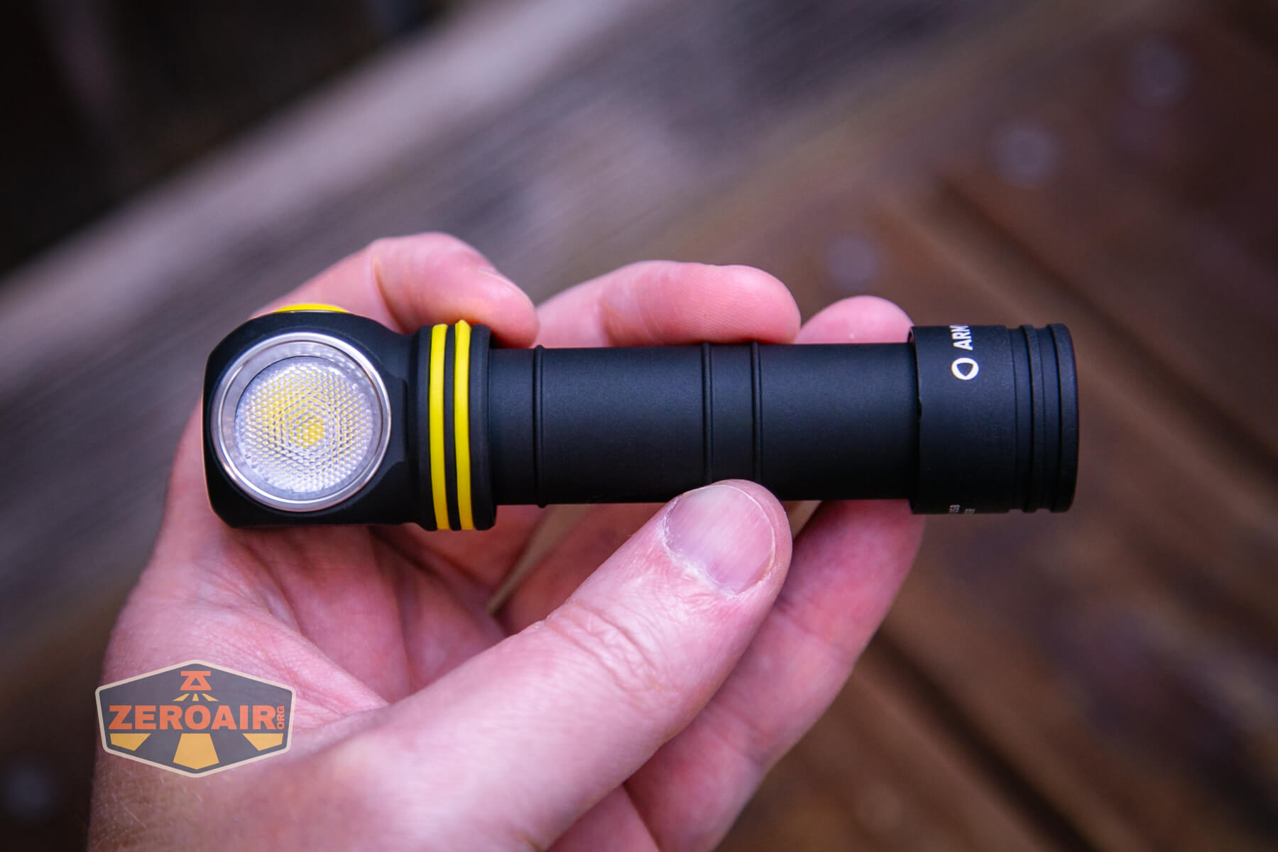 Armytek Elf C2 Warm headlamp in hand