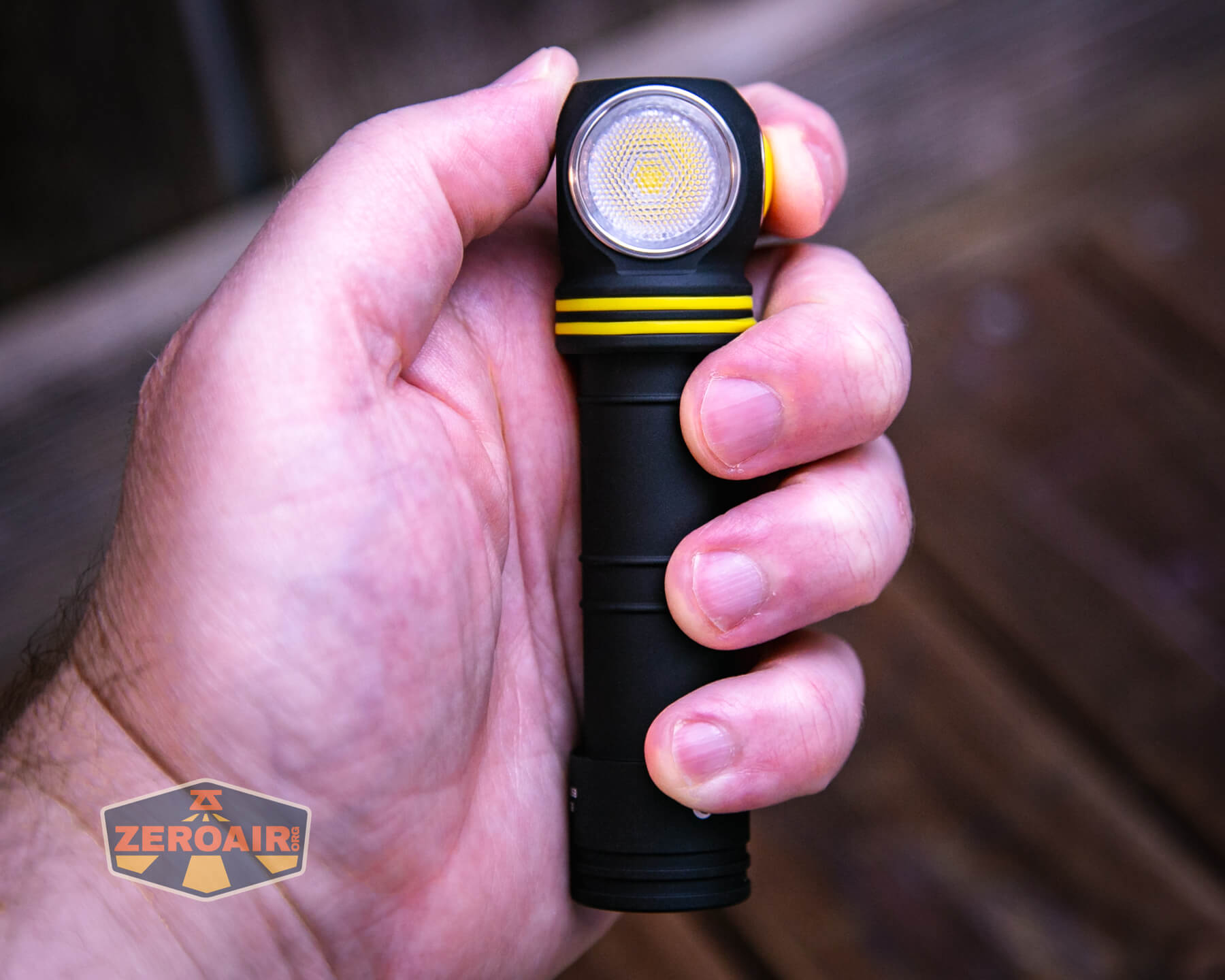 Armytek Elf C2 Warm headlamp in hand