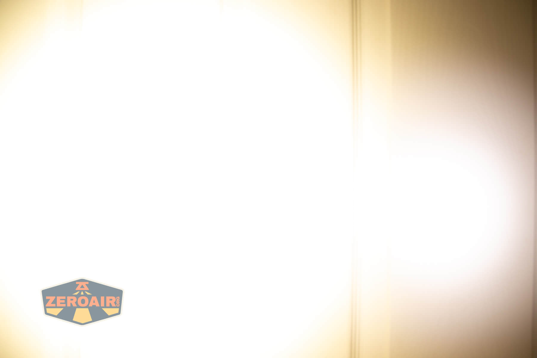 Armytek Elf C2 Warm headlamp beamshots on door compared to nichia 219b