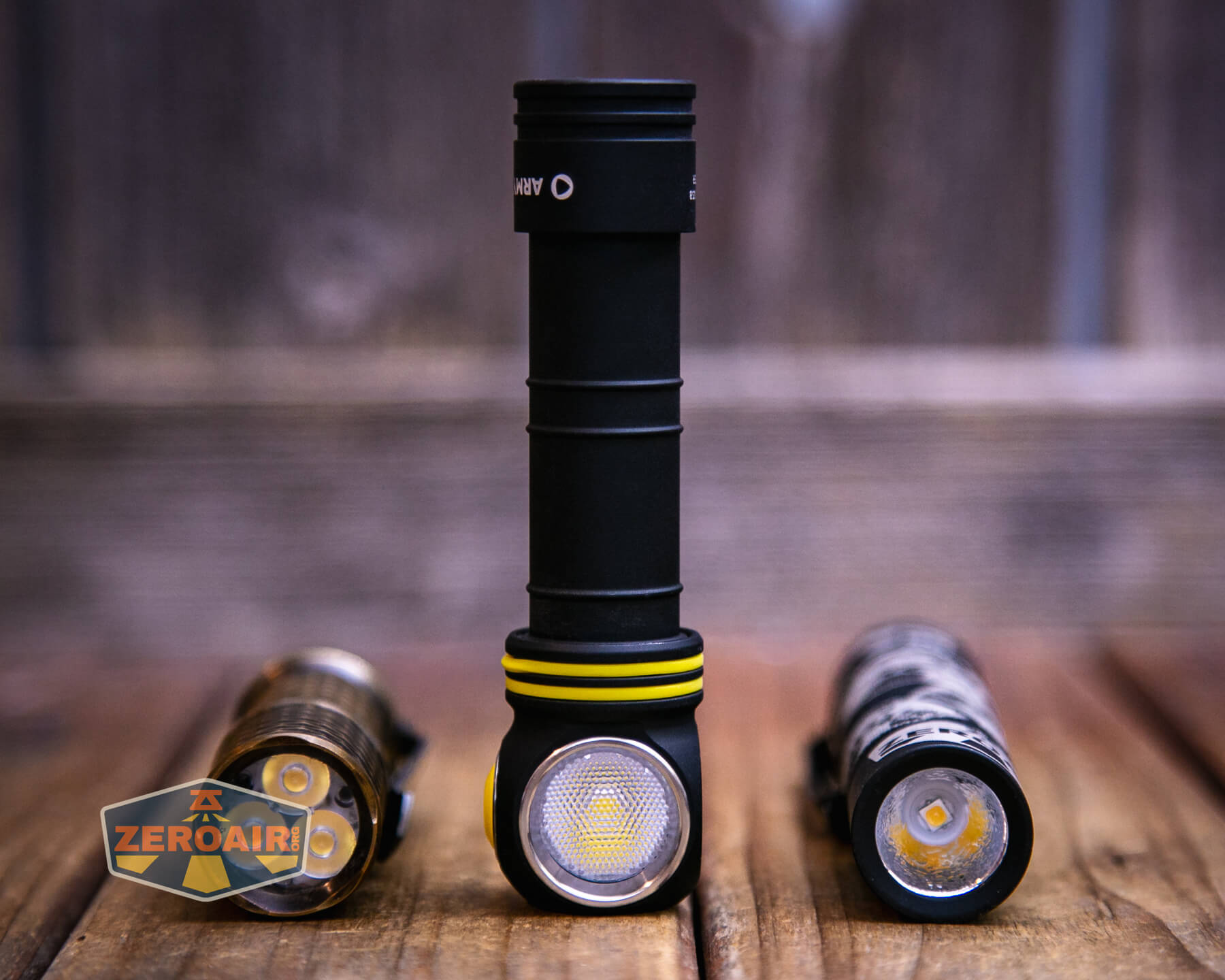 Armytek Elf C2 Warm headlamp with two standard sized flashlights