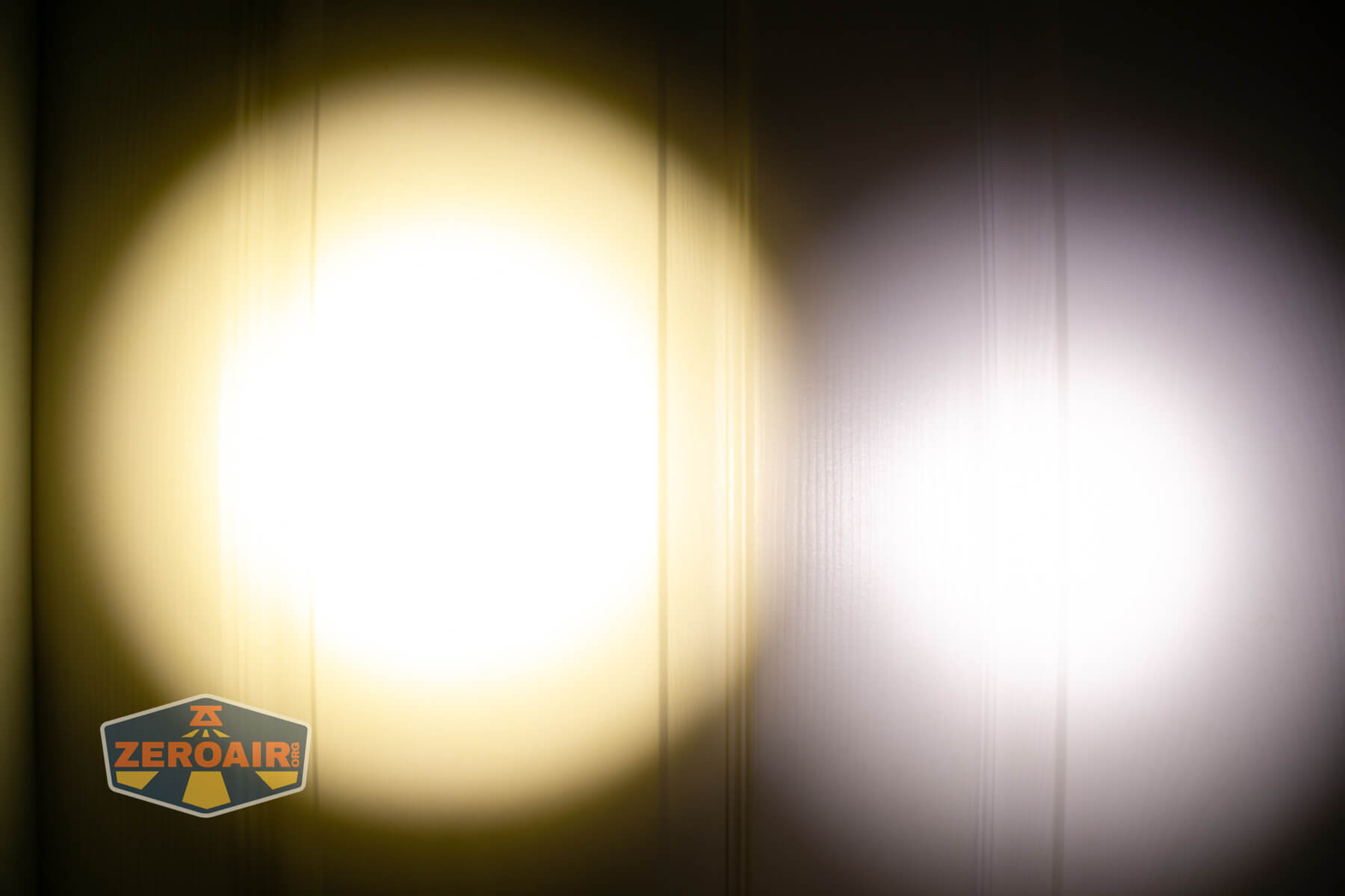 Armytek Viking Pro Magnet USB tactical flashlight beamshots on door (at 1') compared to nichia 219b 4500K