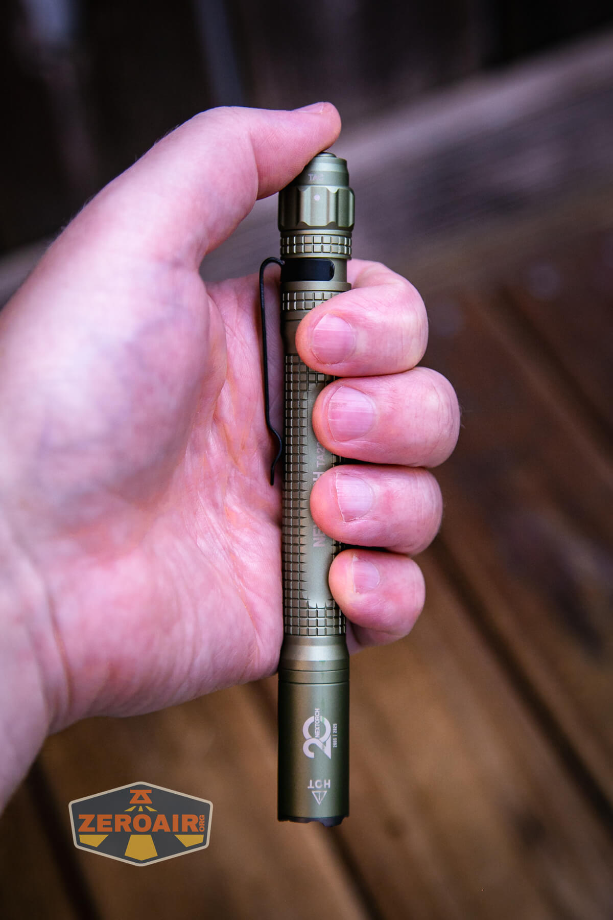 Nextorch TA22 20th anniversary penlight in hand