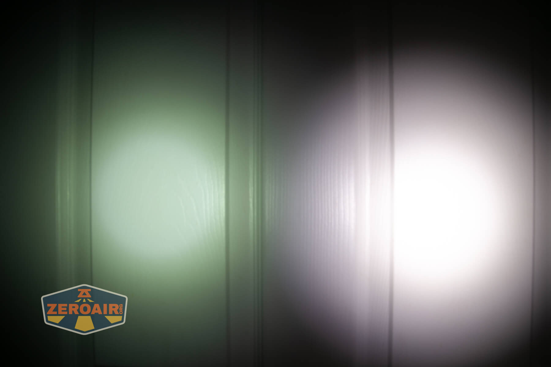 Nextorch TA22 20th anniversary penlight beamshots on door (at 1') compared to nichia 219b 4500K