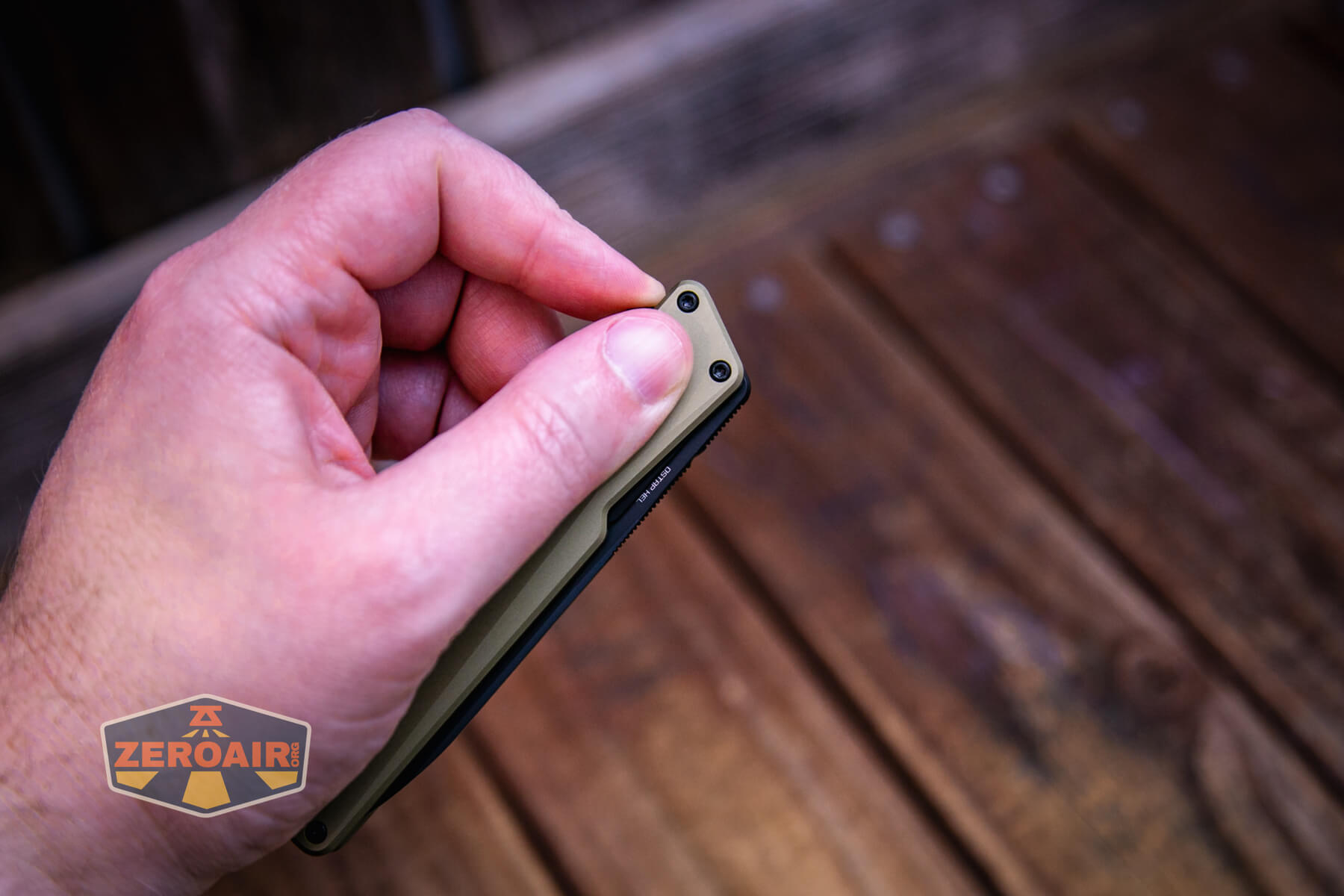 Olight Aion Gentleman's folding knife flip action