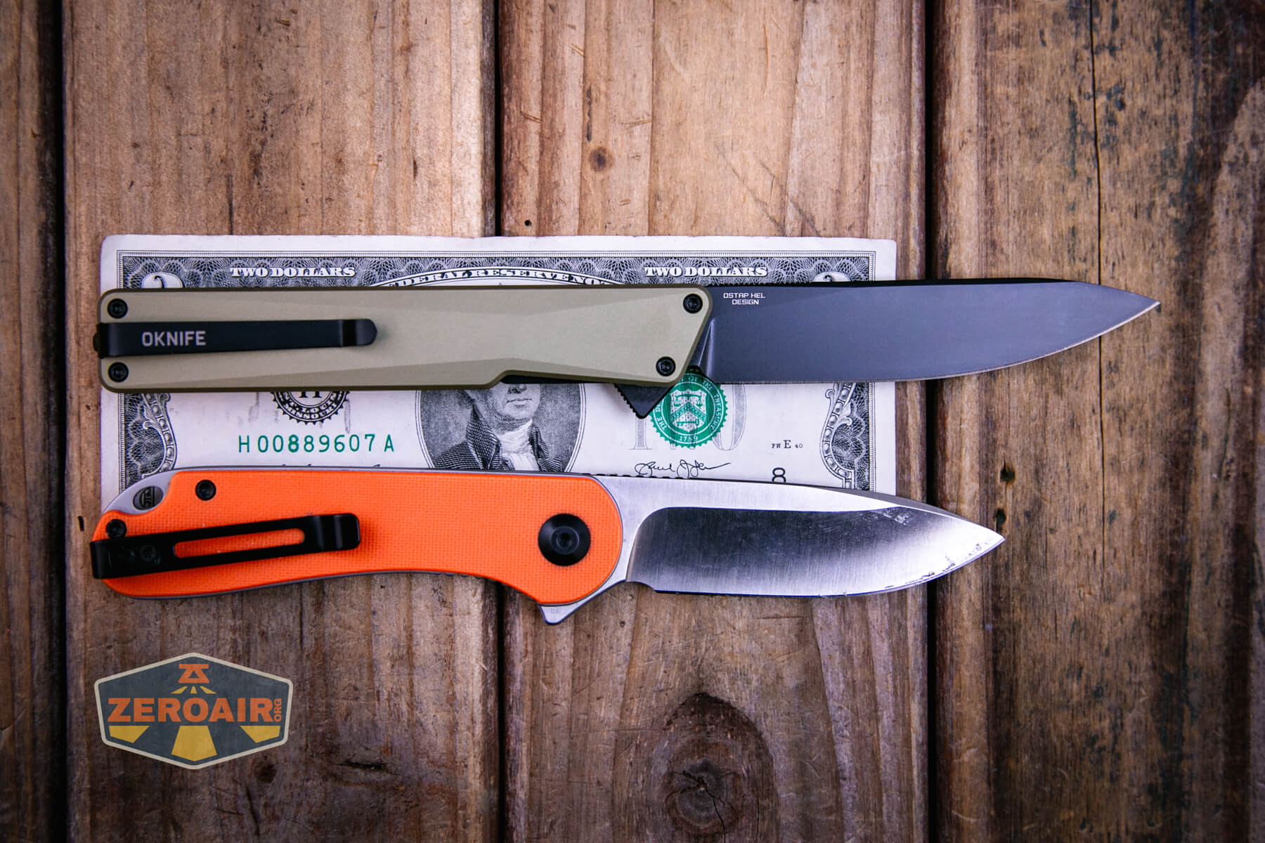 Olight Oknife Aion gentleman's folding knife on a two dollar bill compared to Civivi Elementum in orange