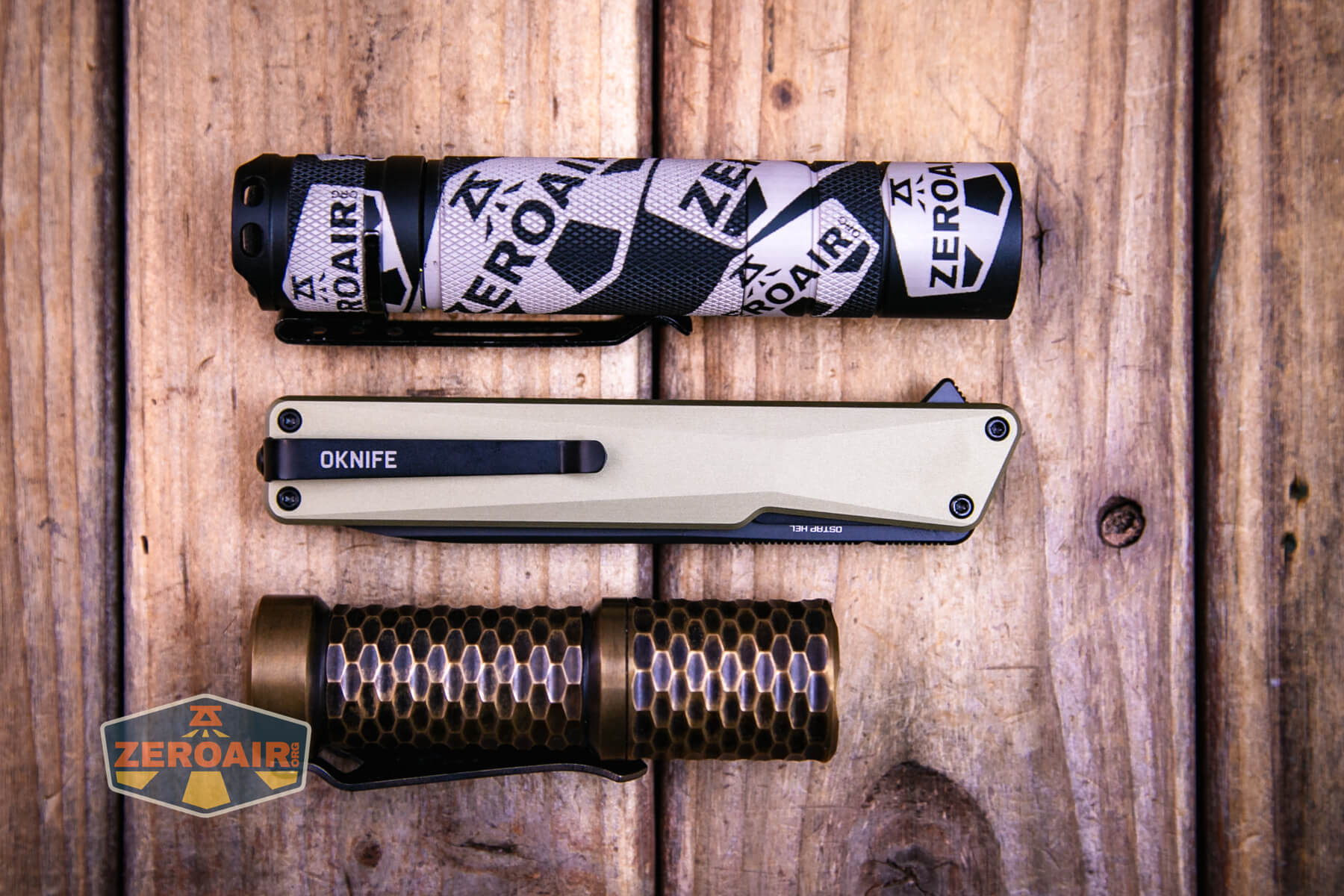 Olight Oknife Aion gentleman's folding knife with two standard sized flashlights