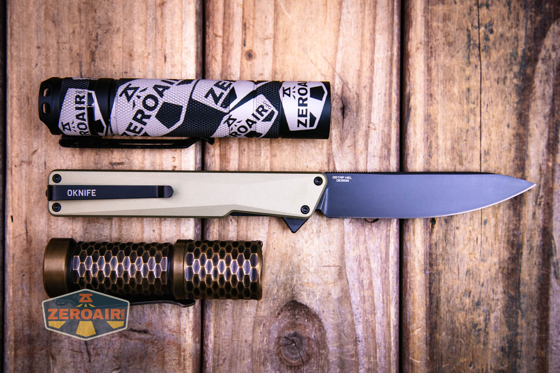 Olight Oknife Aion gentleman's folding knife with two standard sized flashlights