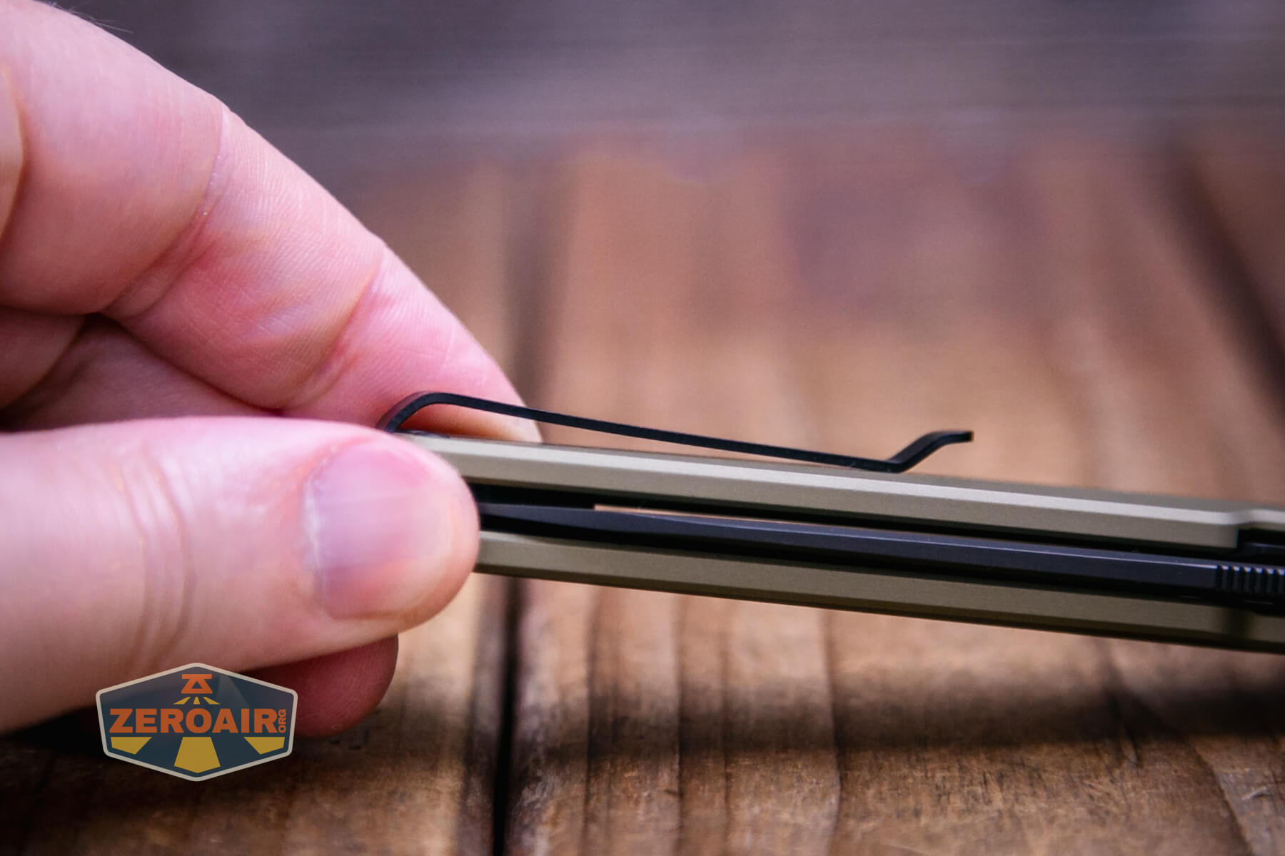 Olight Aion Gentleman's folding knife pocket clip profile view