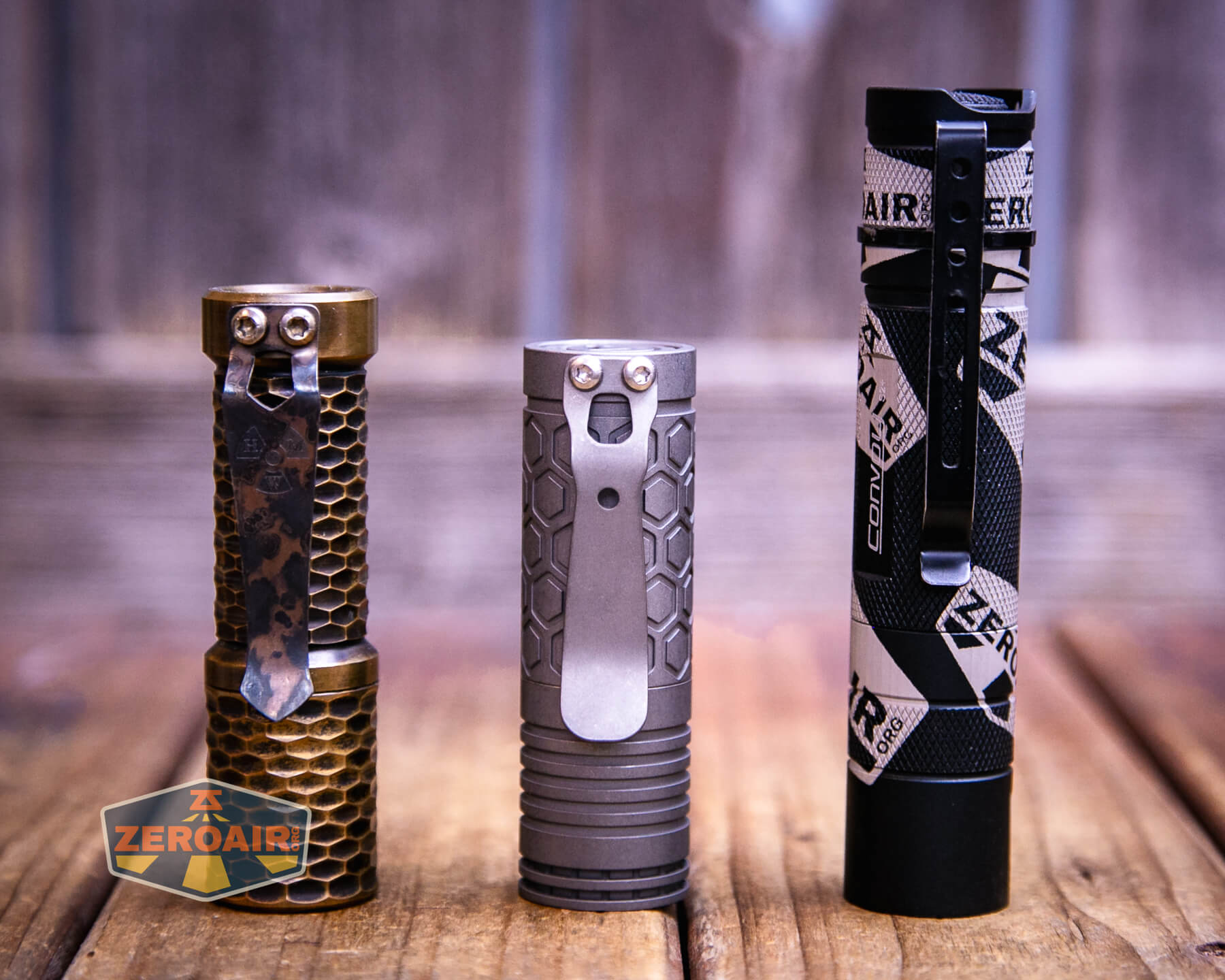 Reylight Dawn Hex-Ti 18350 flashlight with two standard sized flashlights