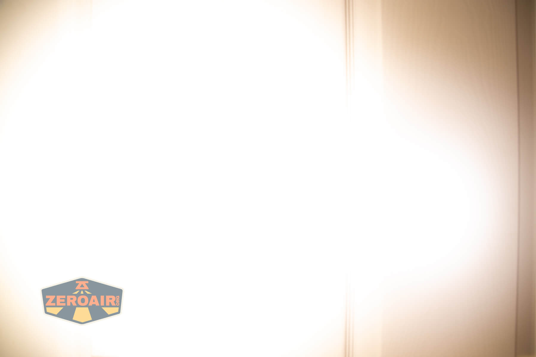 Reylight Dawn Hex-Ti 18350 flashlight beamshots on door (at 1') compared to nichia 219b 4500K