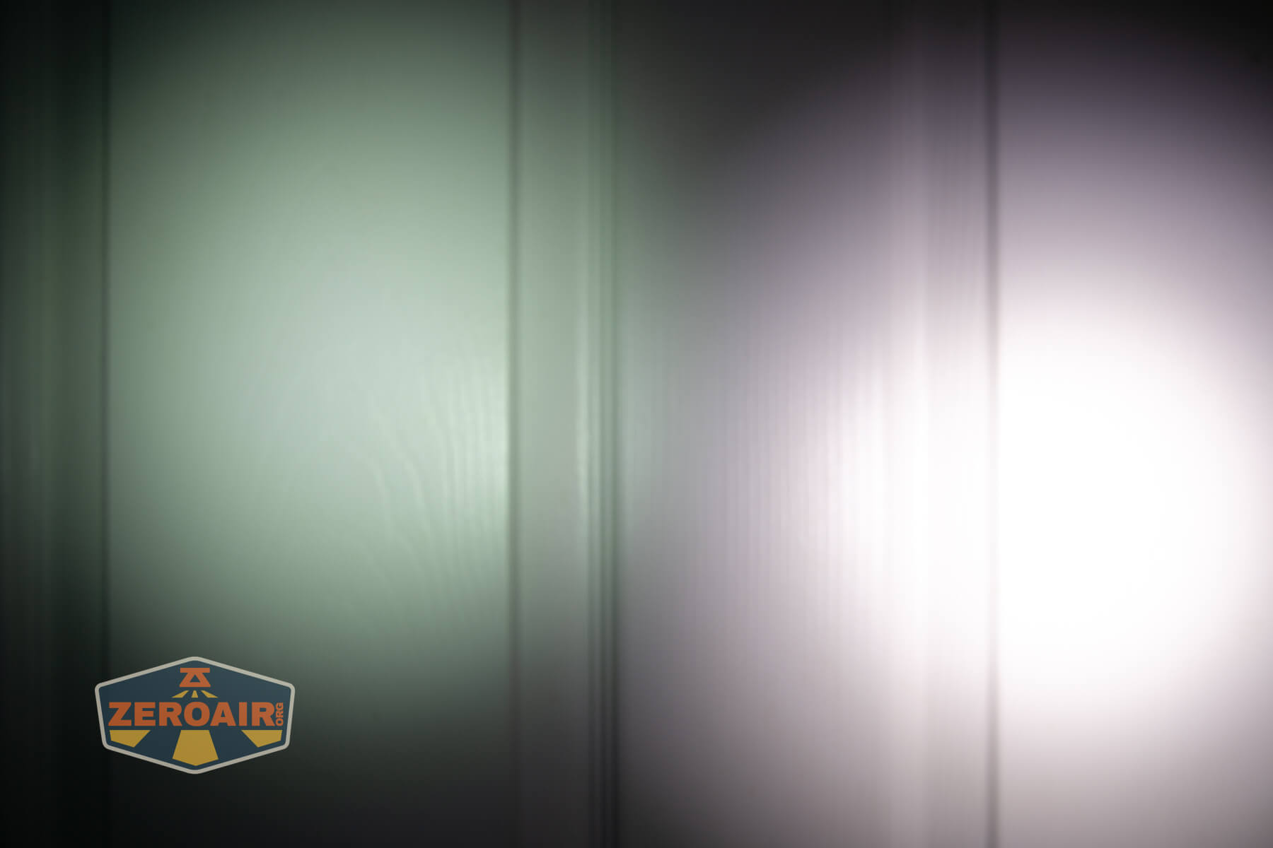 Speras U1 multi-function clip light beamshots on door compared to nichia 219b