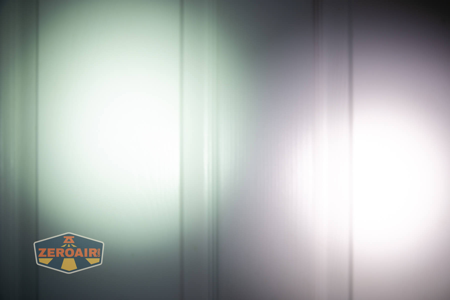 Speras U1 multi-function clip light beamshots on door compared to nichia 219b