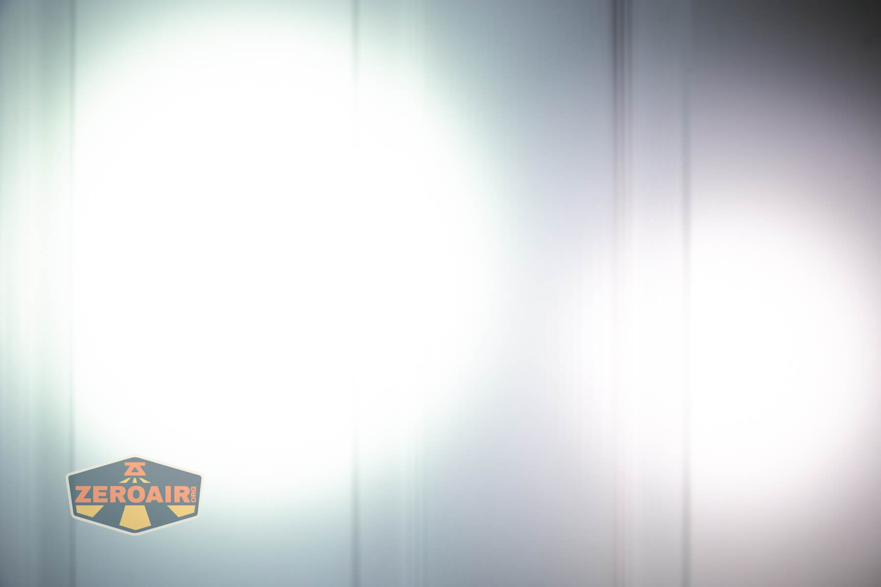 Speras U1 multi-function clip light beamshots on door compared to nichia 219b