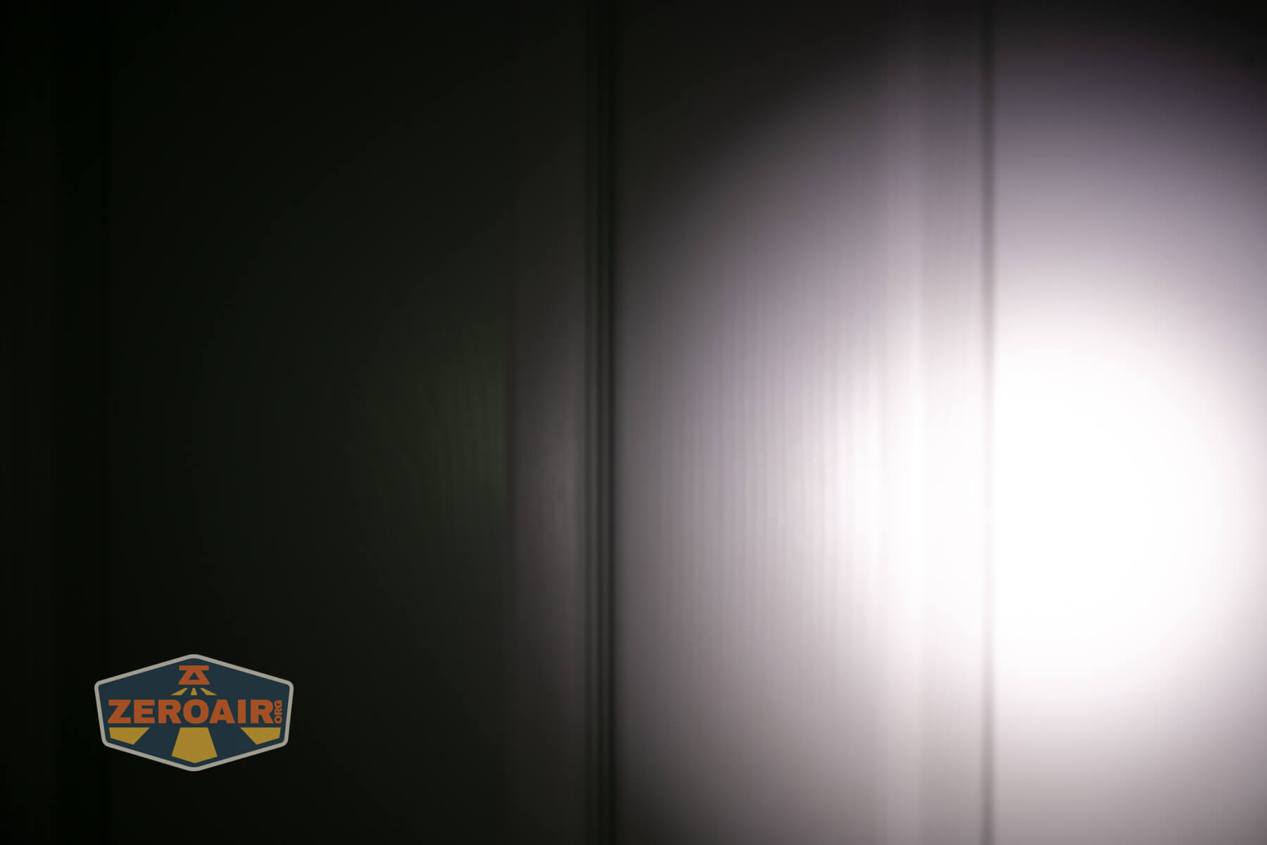 Speras U1 multi-function clip light beamshots on door compared to nichia 219b