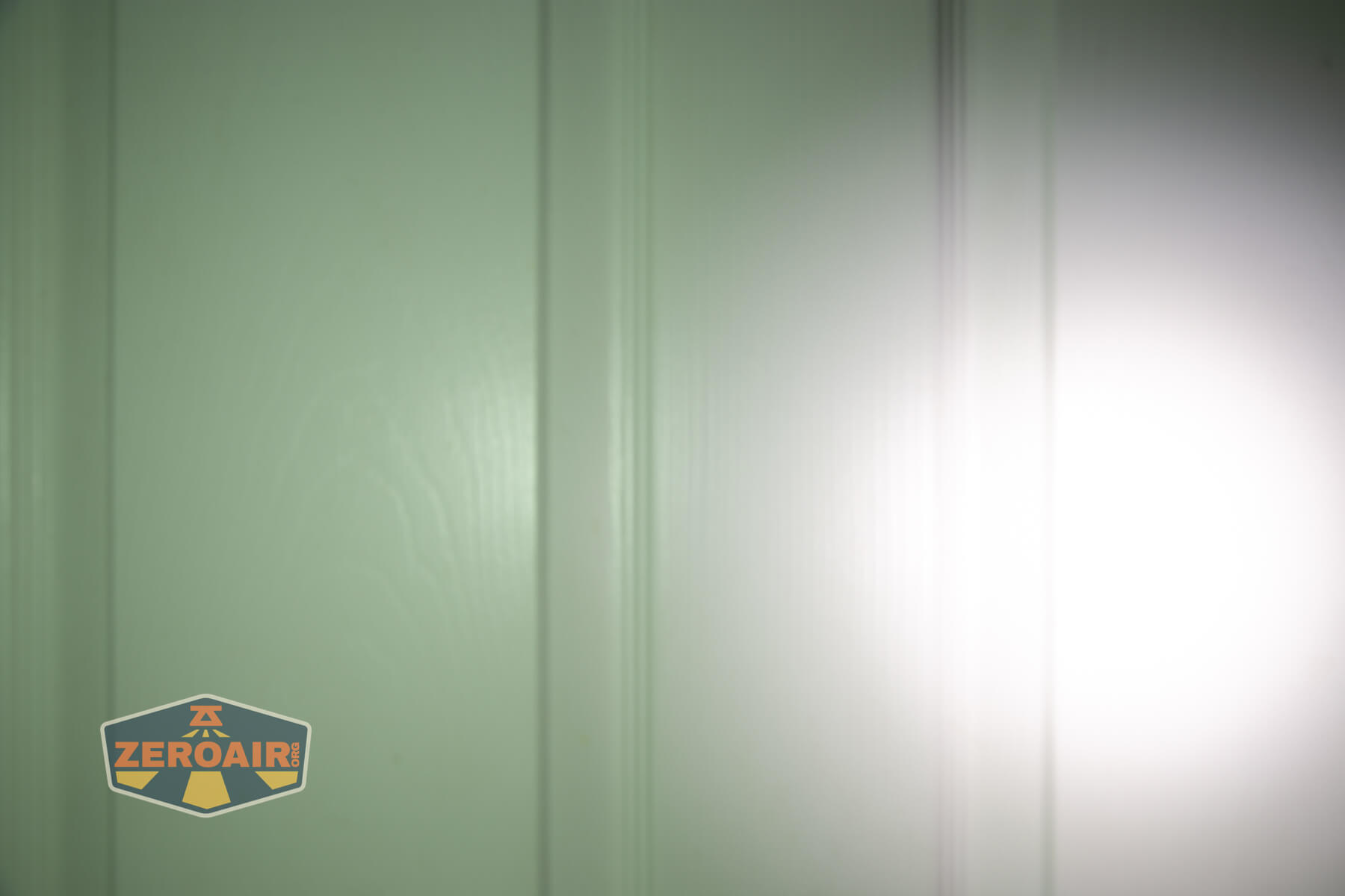 Speras U1 multi-function clip light beamshots on door compared to nichia 219b