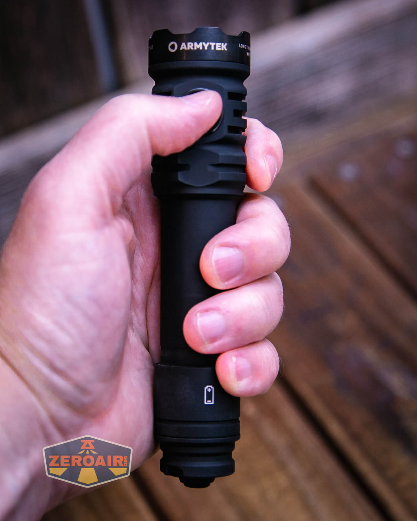 Armytek Dobermann Pro Max tactical flashlight in hand