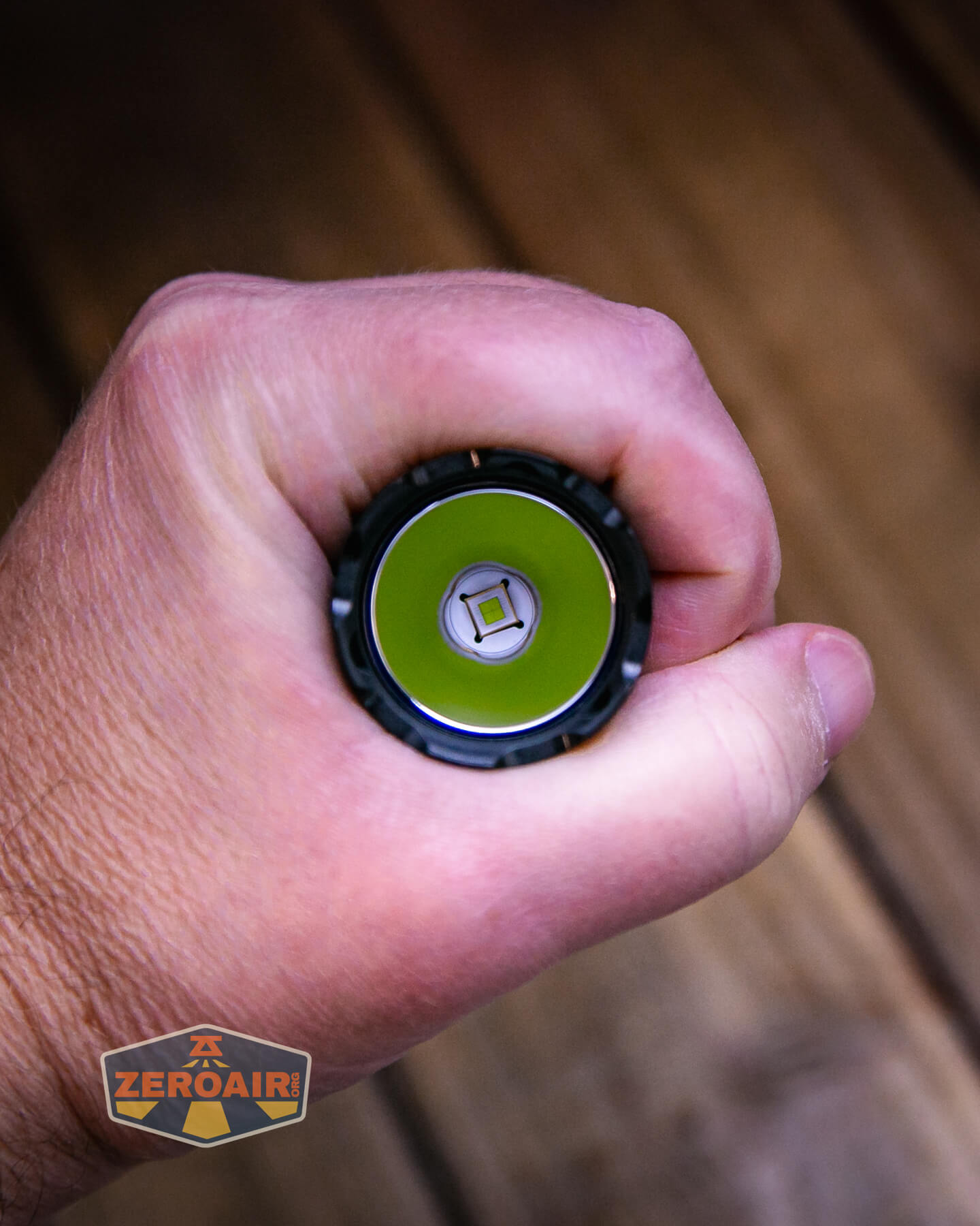 Armytek Dobermann Pro Max tactical flashlight in hand