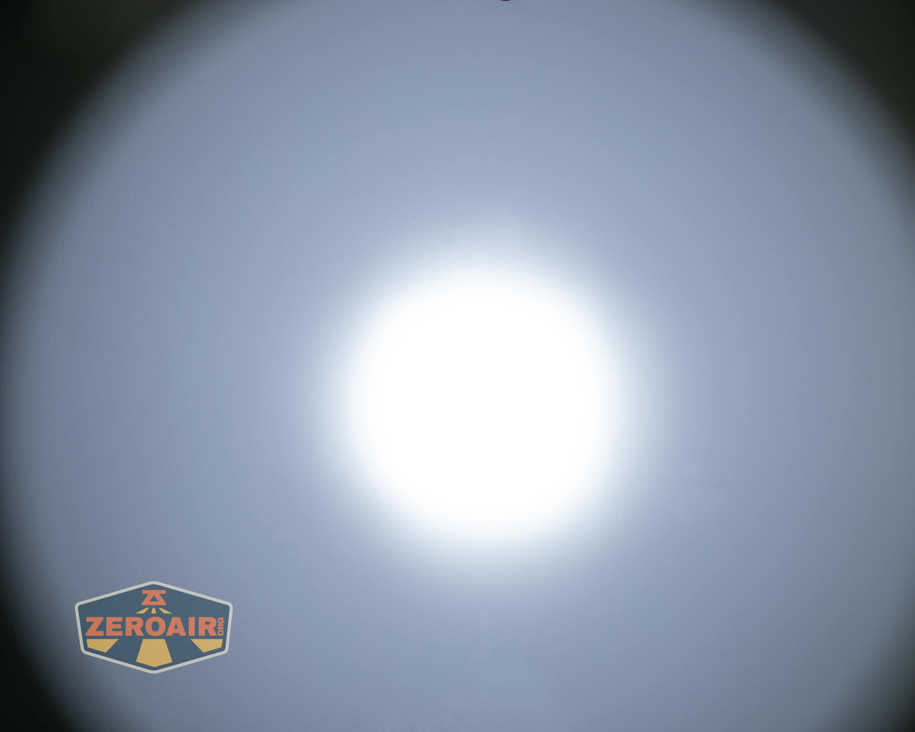 Armytek Dobermann Pro Max tactical flashlight beamshots on ceiling