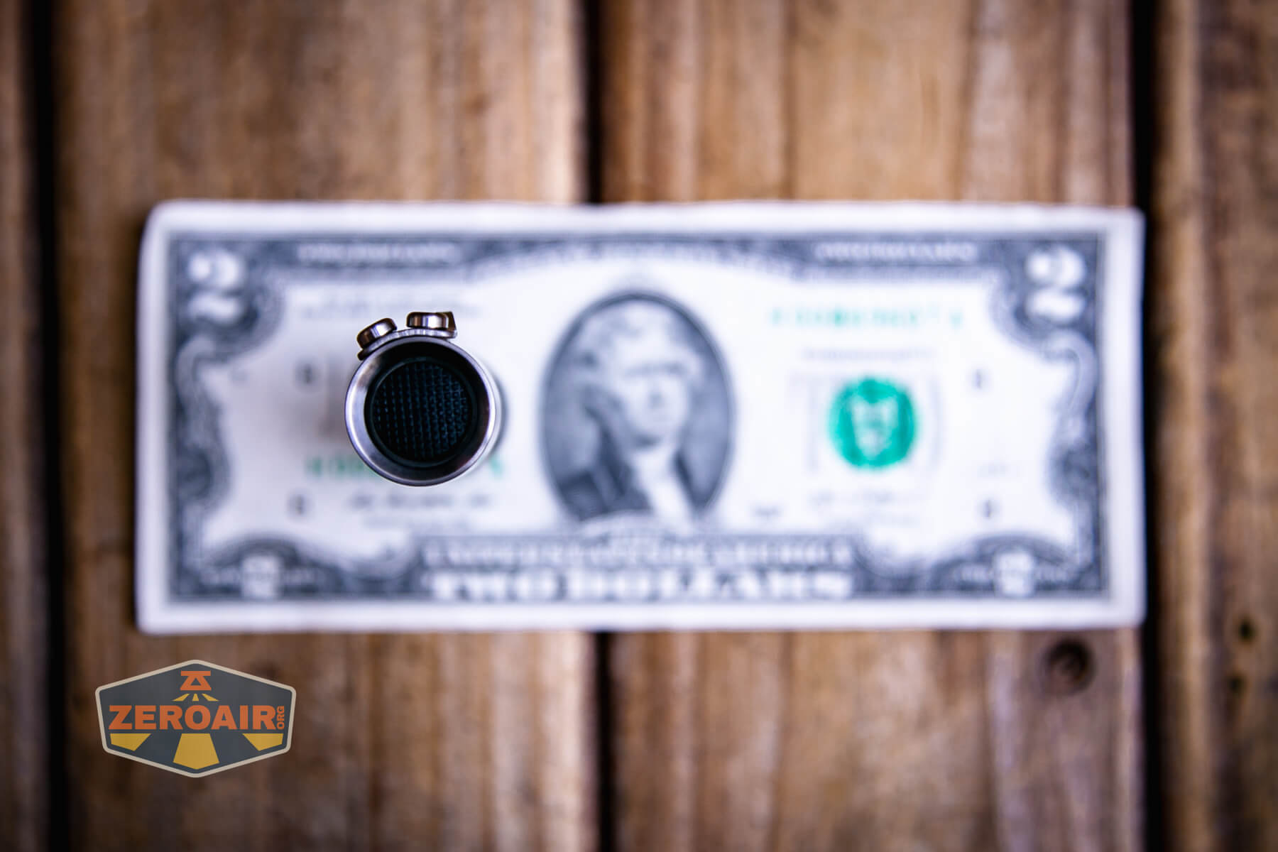 CWF Mini Arc flashlight on a two dollar bill