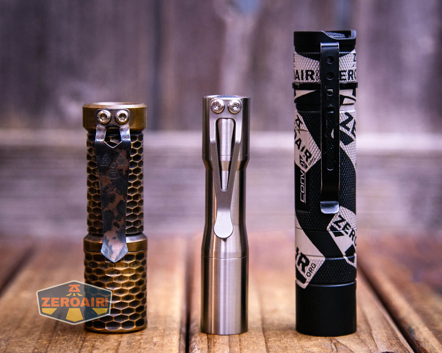 CWF Mini Arc flashlight with two standard sized flashlights