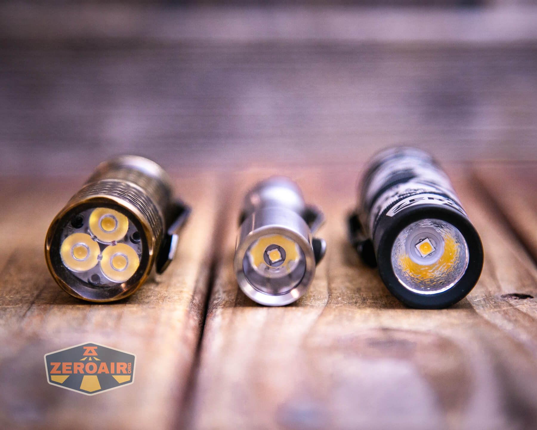 CWF Mini Arc flashlight with two standard sized flashlights