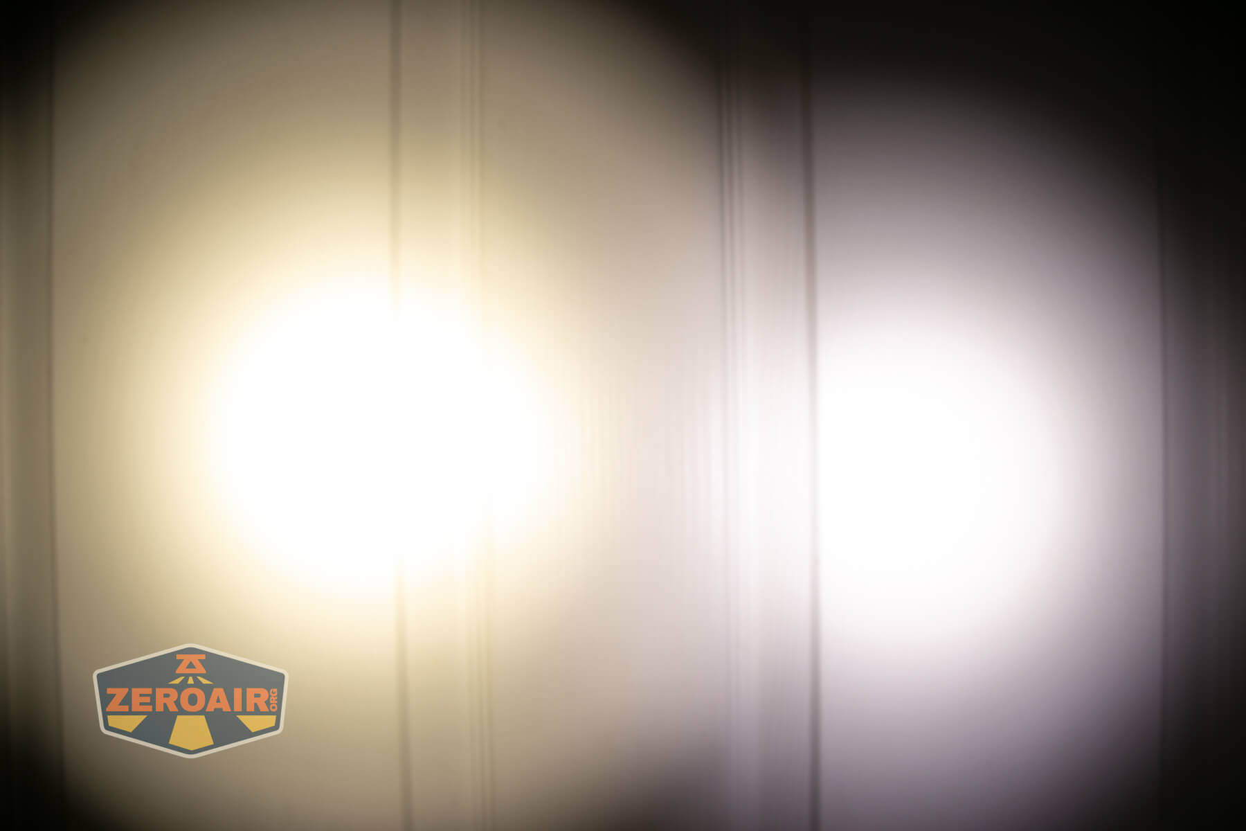 CWF Mini Arc flashlight beamshots on door (at 1') compared to nichia 219b 4500K