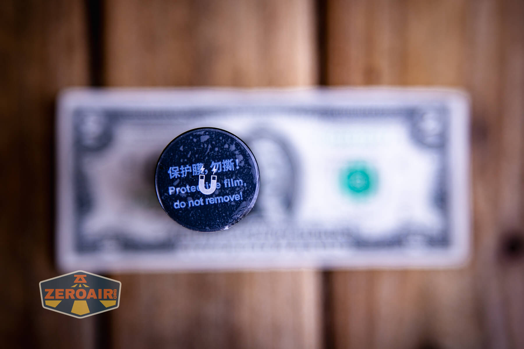 Nextorch C61 Dual-Beam flashlight on a two dollar bill