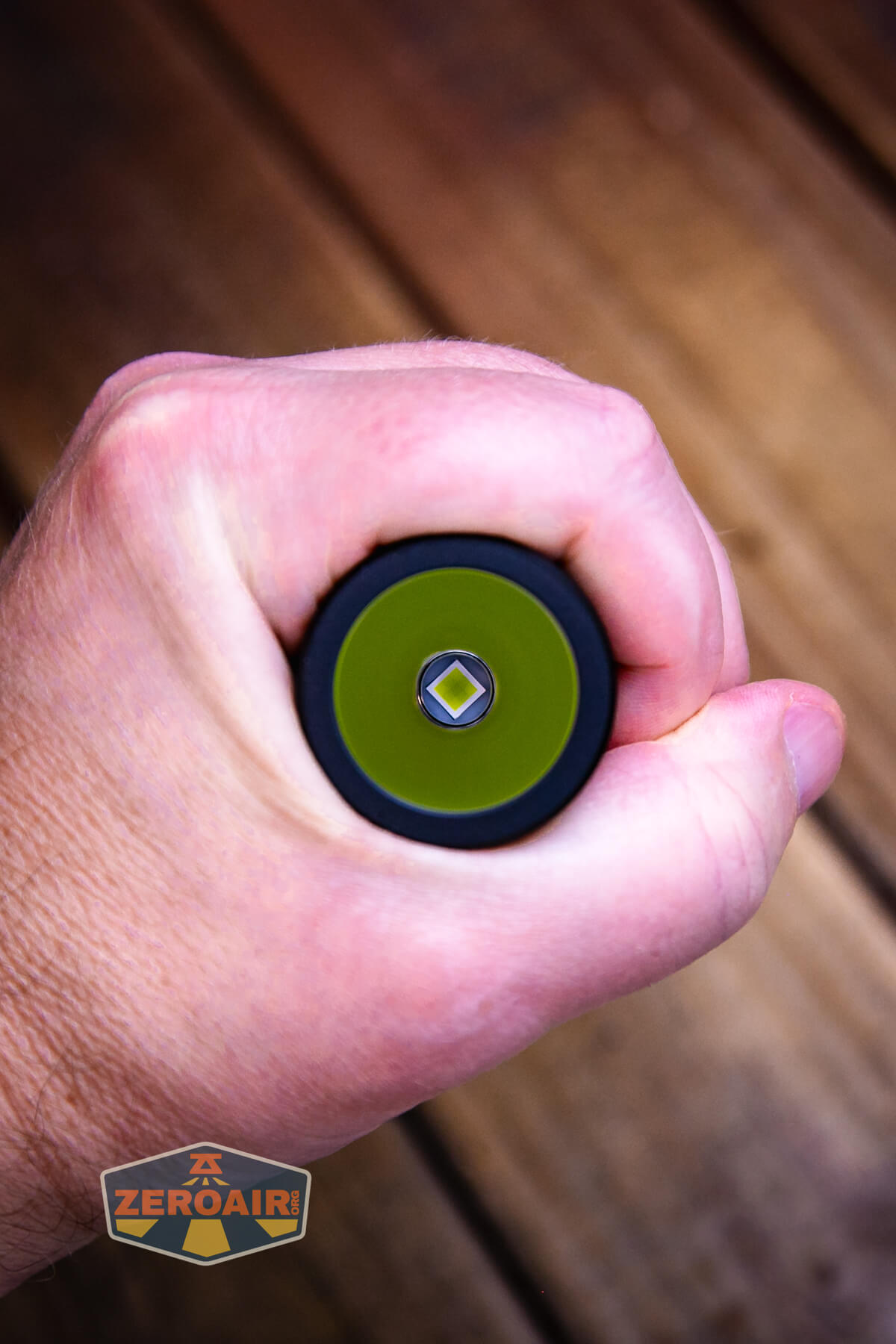 Nextorch C61 Dual-Beam flashlight in hand