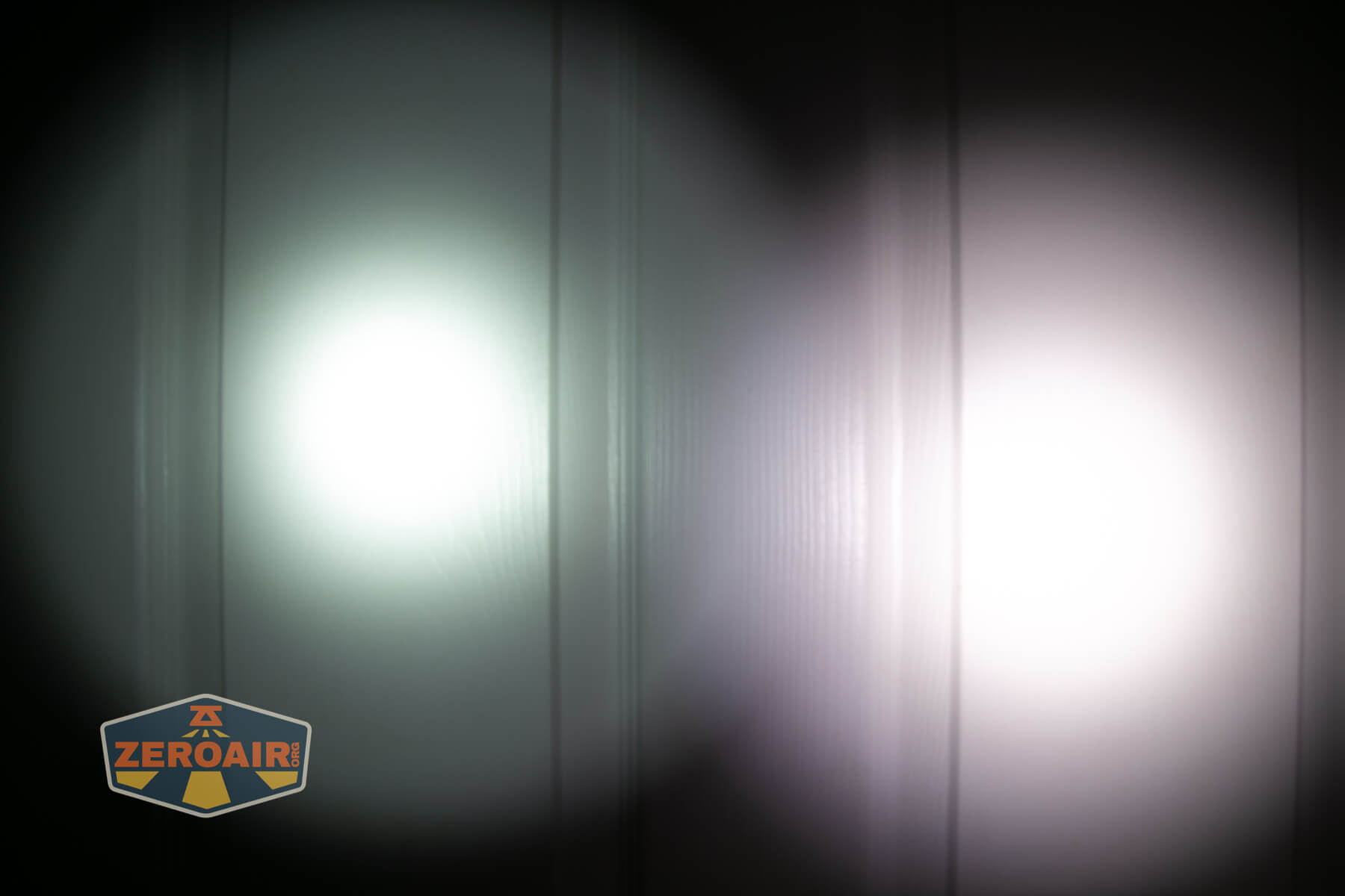 Nextorch C61 Dual-Beam flashlight beamshots on door (at 1') compared to nichia 219b 4500K