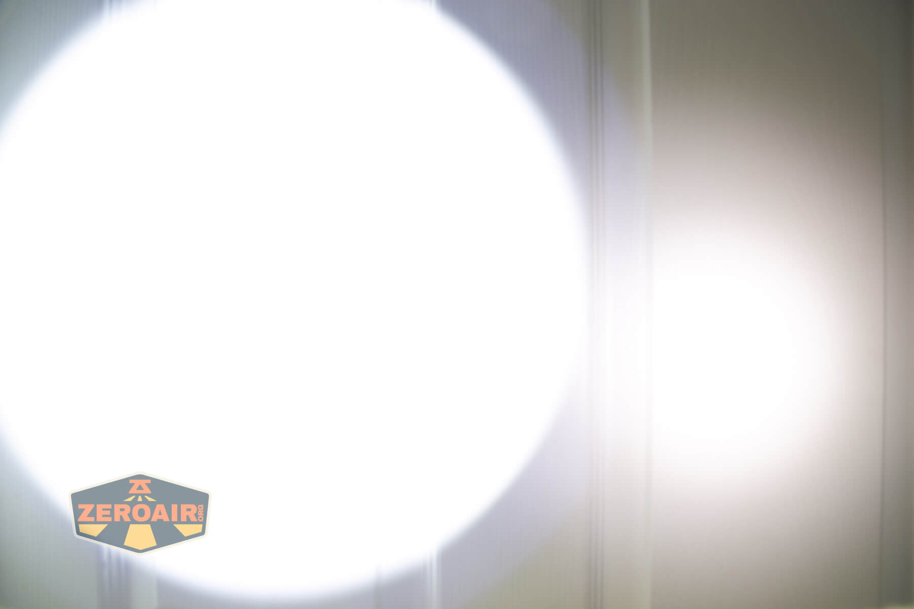 Nextorch C61 Dual-Beam flashlight beamshots on door (at 1') compared to nichia 219b 4500K