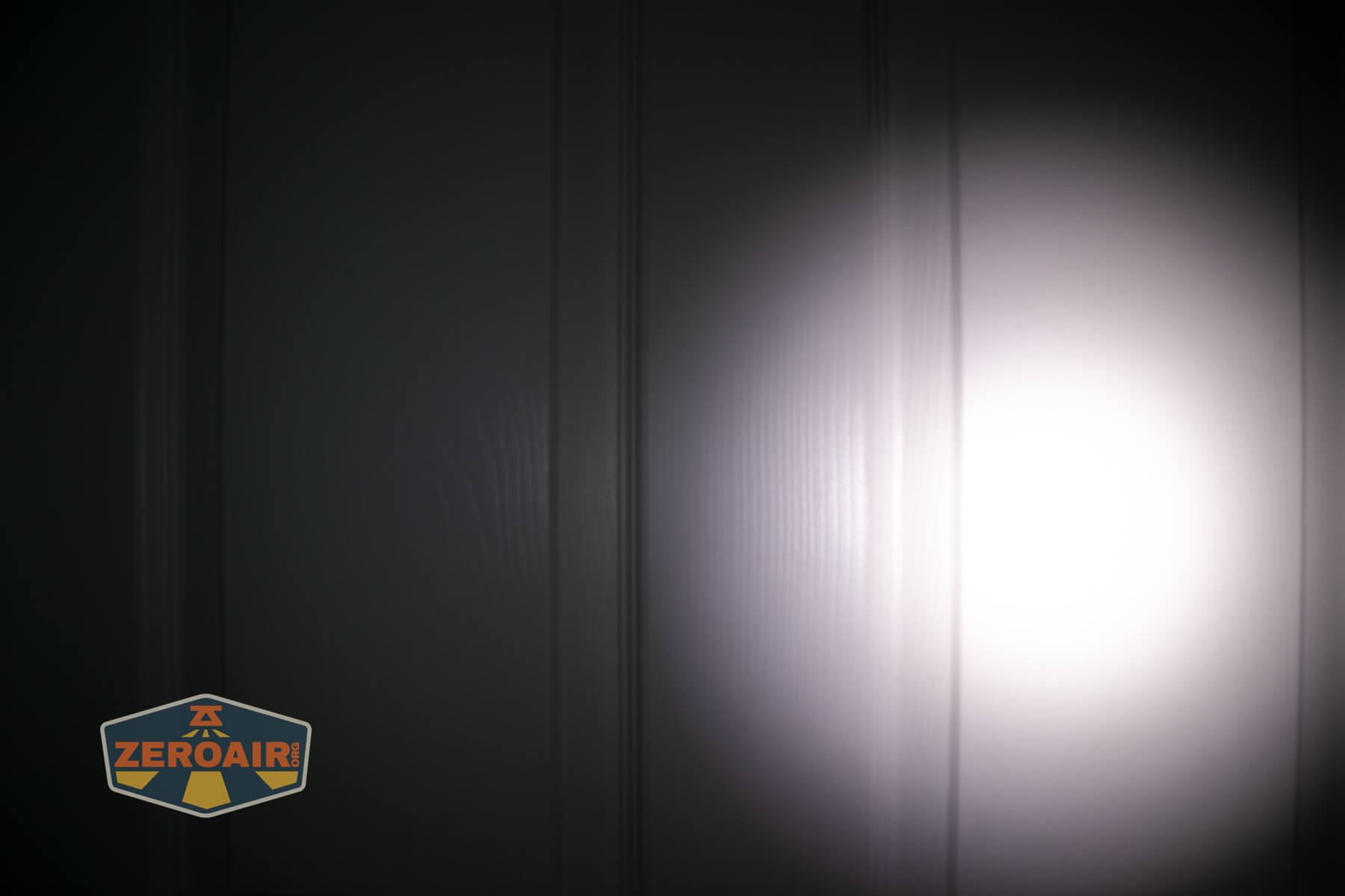 Nextorch C61 Dual-Beam flashlight beamshots on door (at 1') compared to nichia 219b 4500K