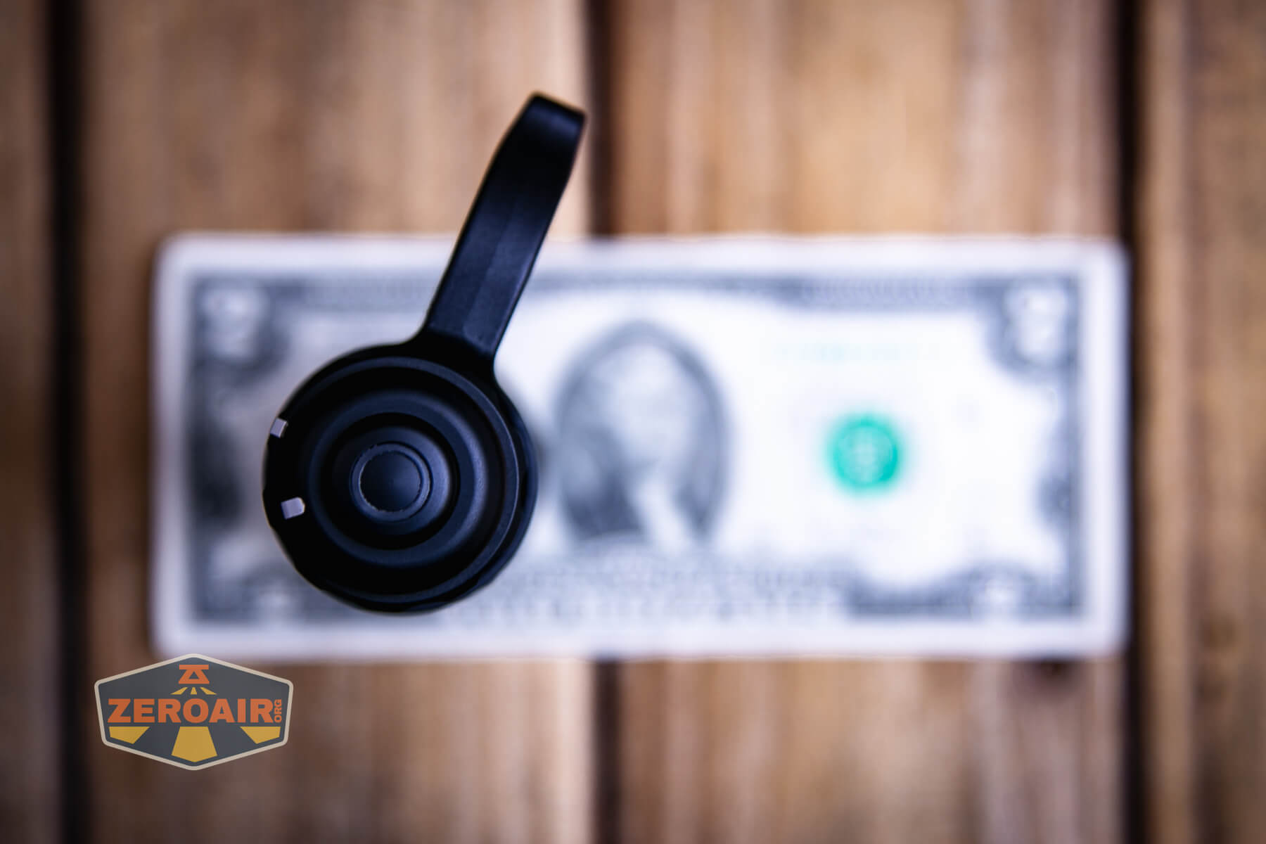 Nextorch TA30D MAX One-Step-Strobe flashlight on a two dollar bill