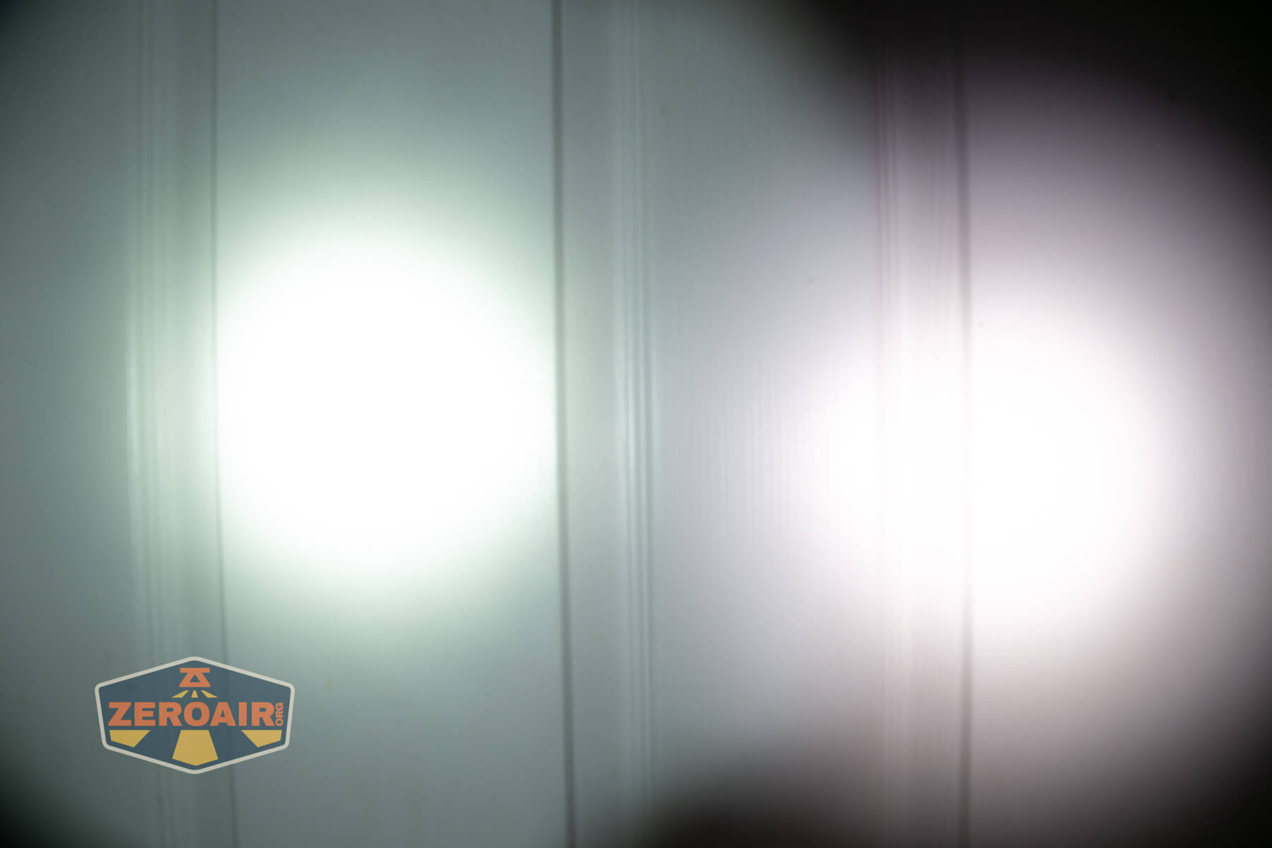 Nextorch TA30D MAX One-Step-Strobe flashlight beamshots on door (at 1') compared to nichia 219b 4500K