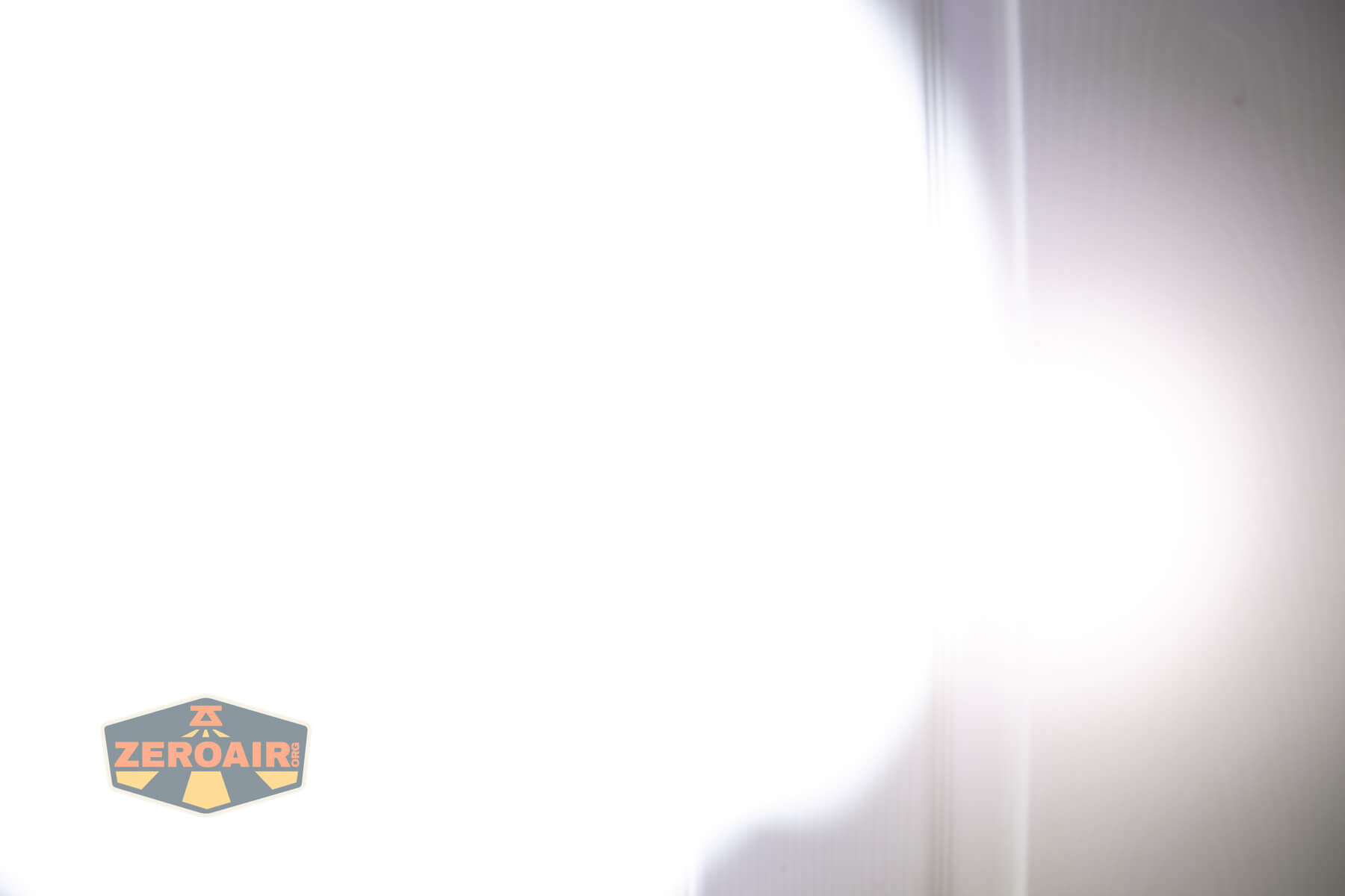 Nextorch TA30D MAX One-Step-Strobe flashlight beamshots on door (at 1') compared to nichia 219b 4500K