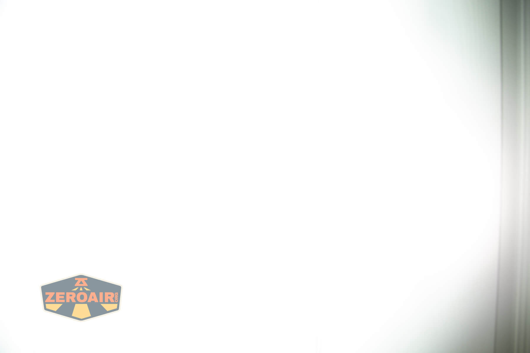 Nitecore EDC37 Flat EDC flashlight beamshots on door (at 1') compared to nichia 219b 4500K