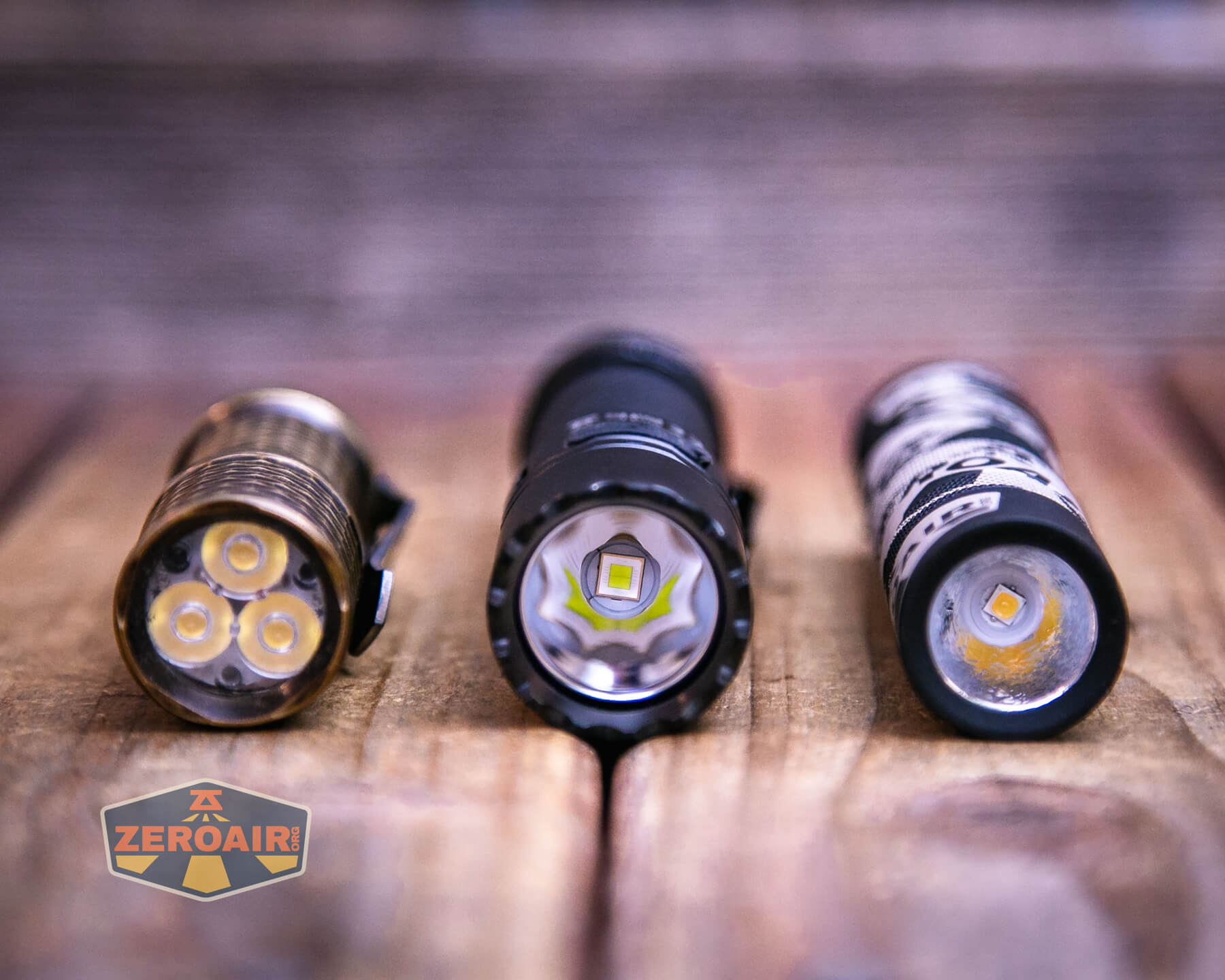 Sofirn SK30 tactical flashlight with two standard sized flashlights