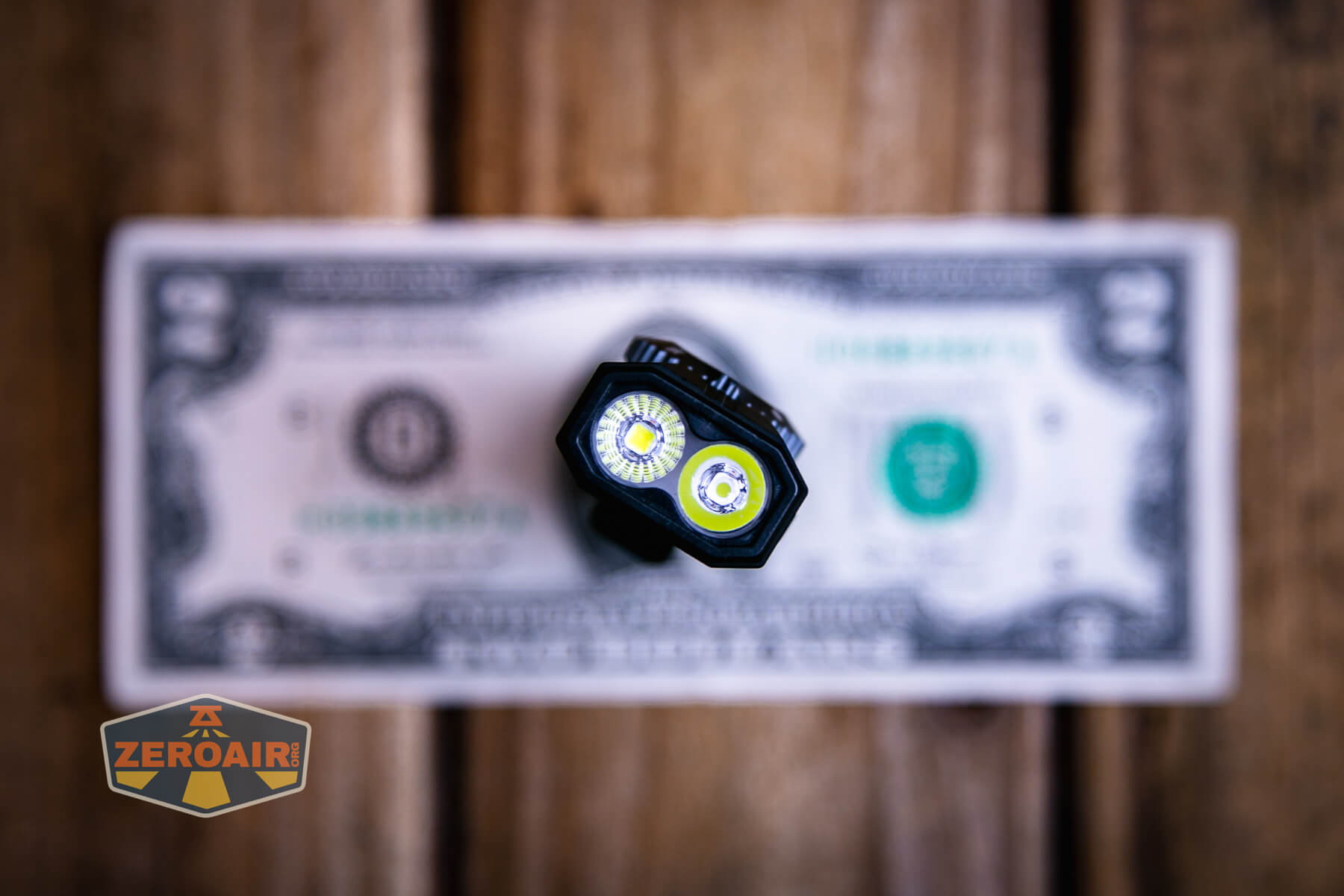 Cyansky Ark II EDC flat flashlight on two dollar bill