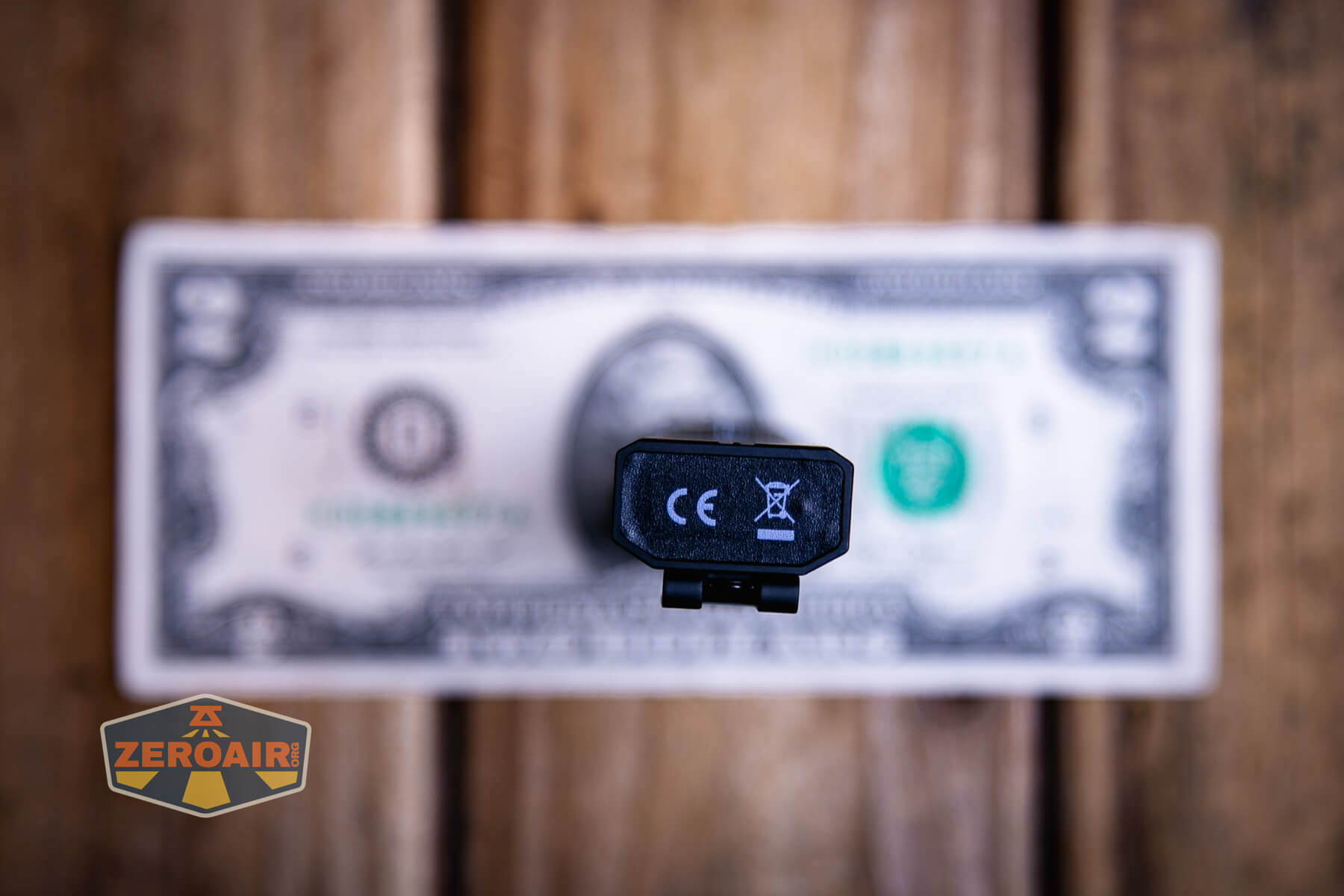 Cyansky Ark II EDC flat flashlight on two dollar bill