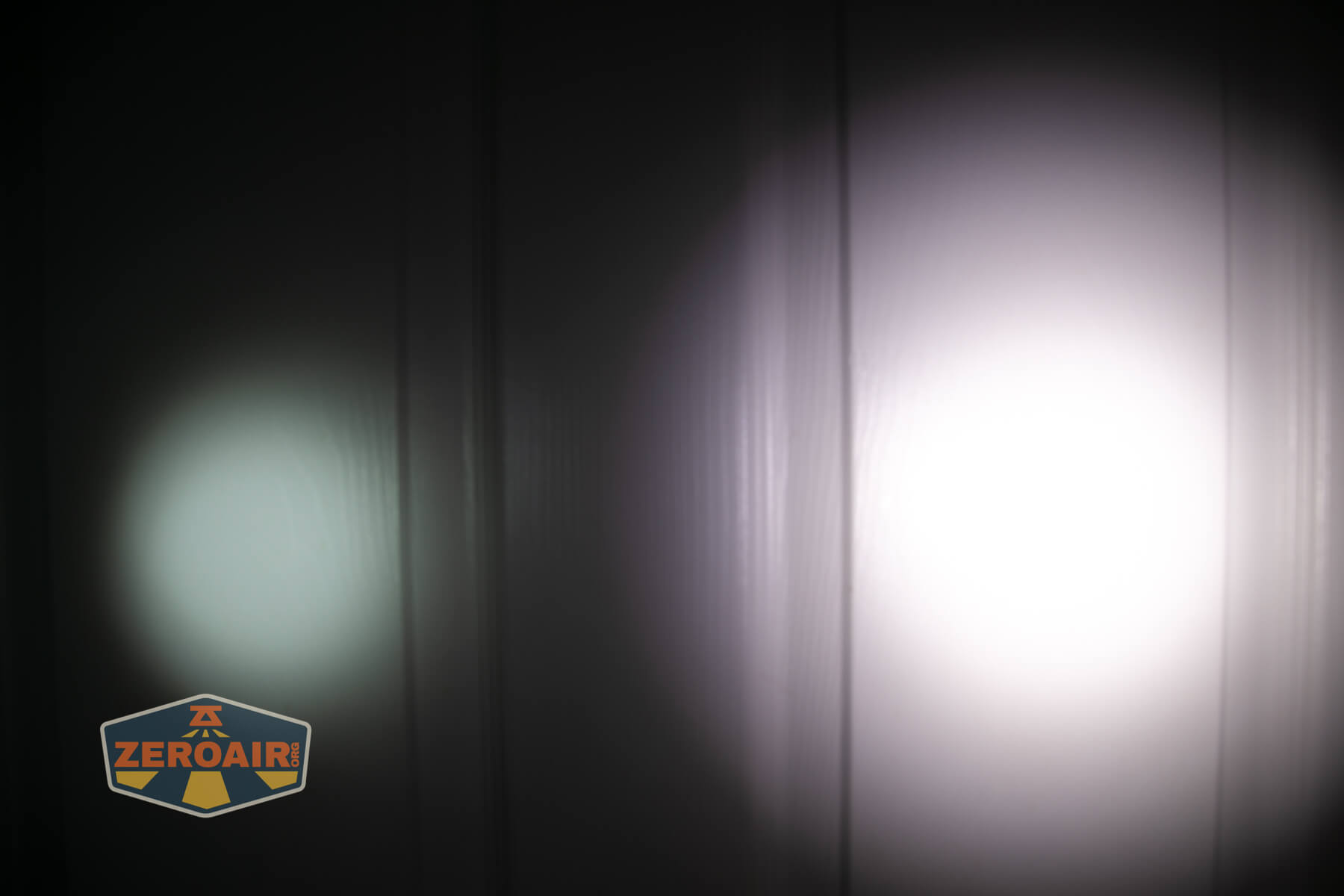 Cyansky Ark II EDC flat flashlight beamshots on door compared to nichia 219b