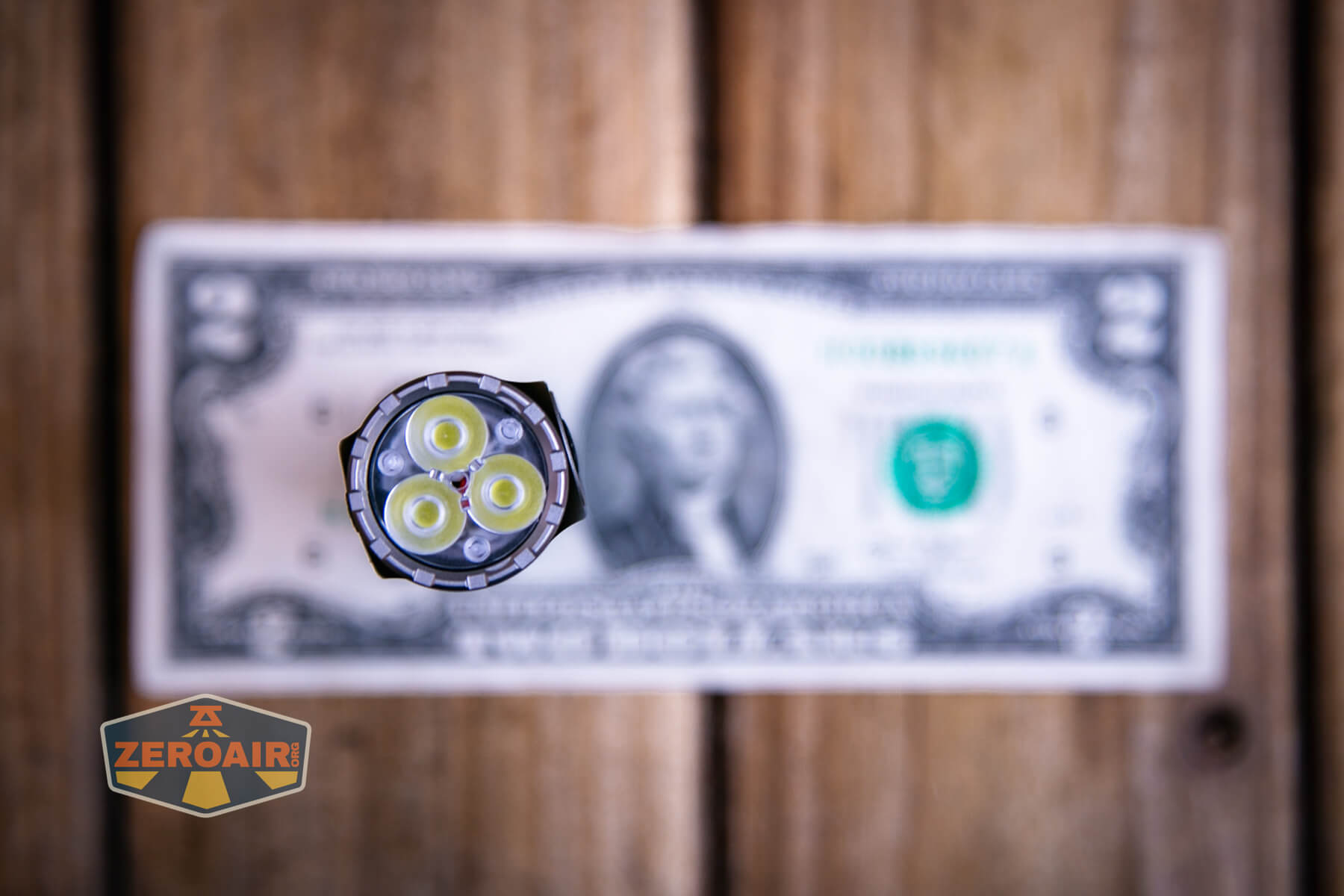 Skilhunt EC200 SFT25R flashlight on a two dollar bill