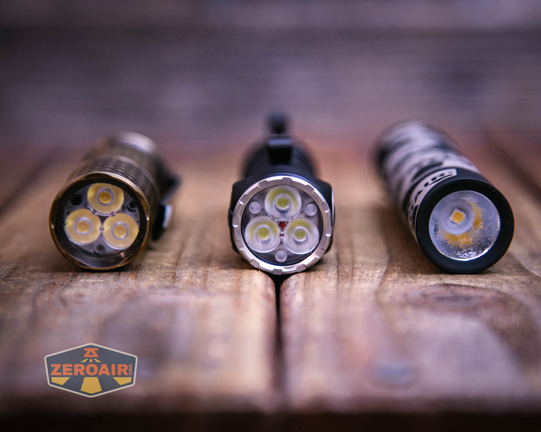 Skilhunt EC200 SFT25R flashlight with two standard sized flashlights